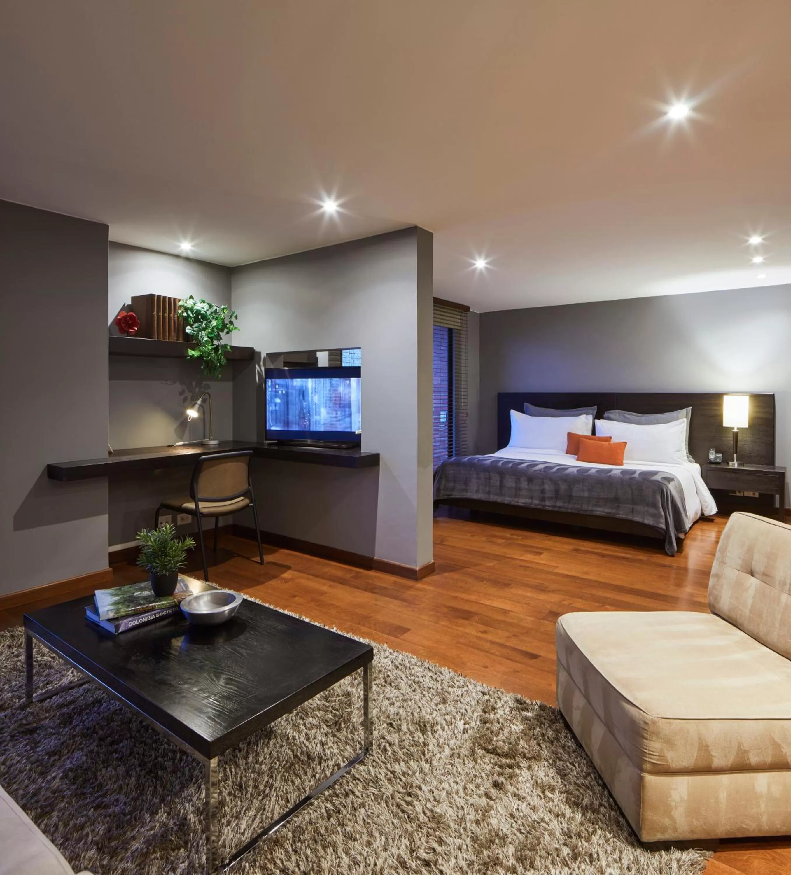 Living room, Bed in Nico Apartasuites