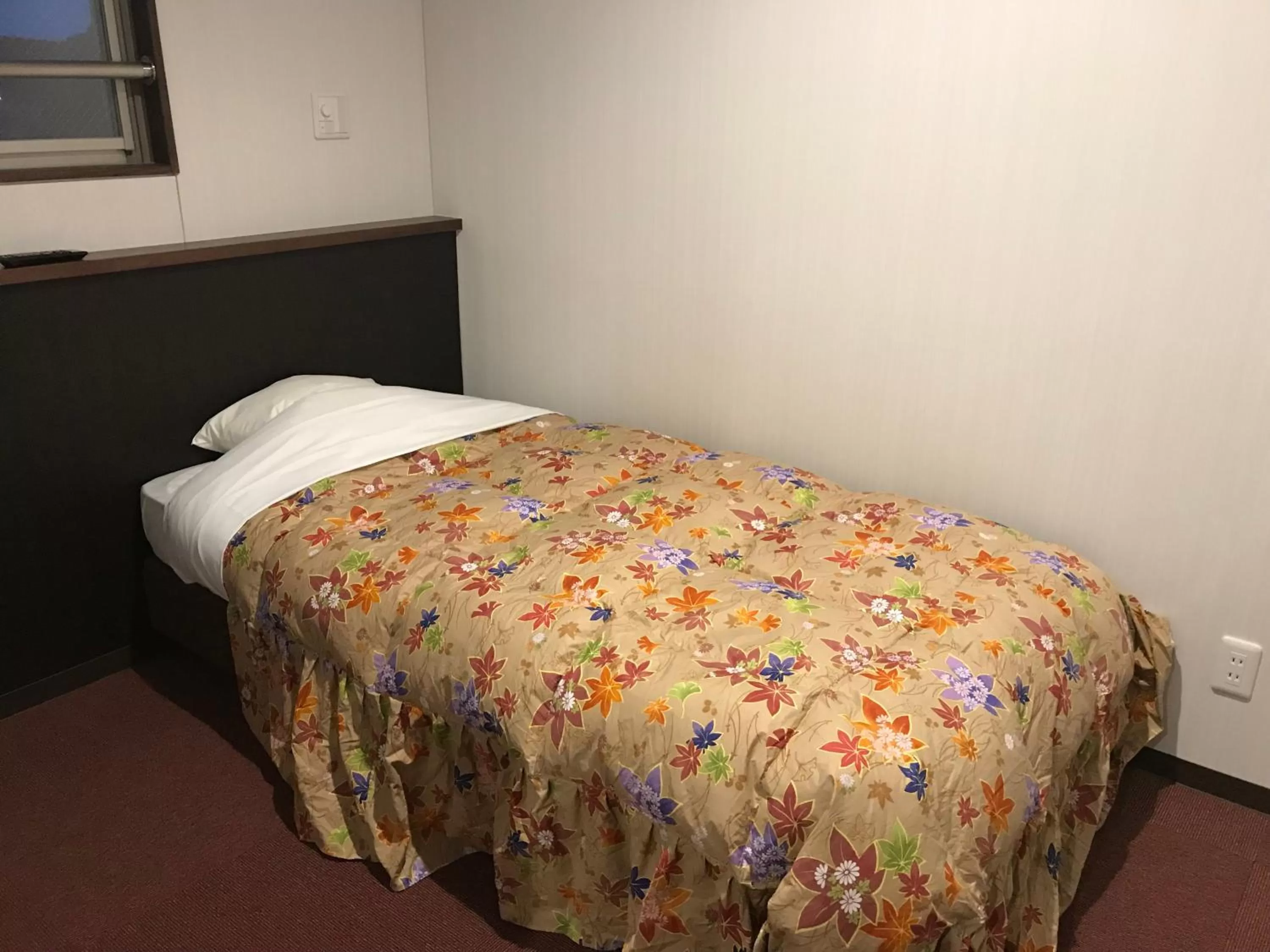 Bed in Hotel Famitic Nikko Station