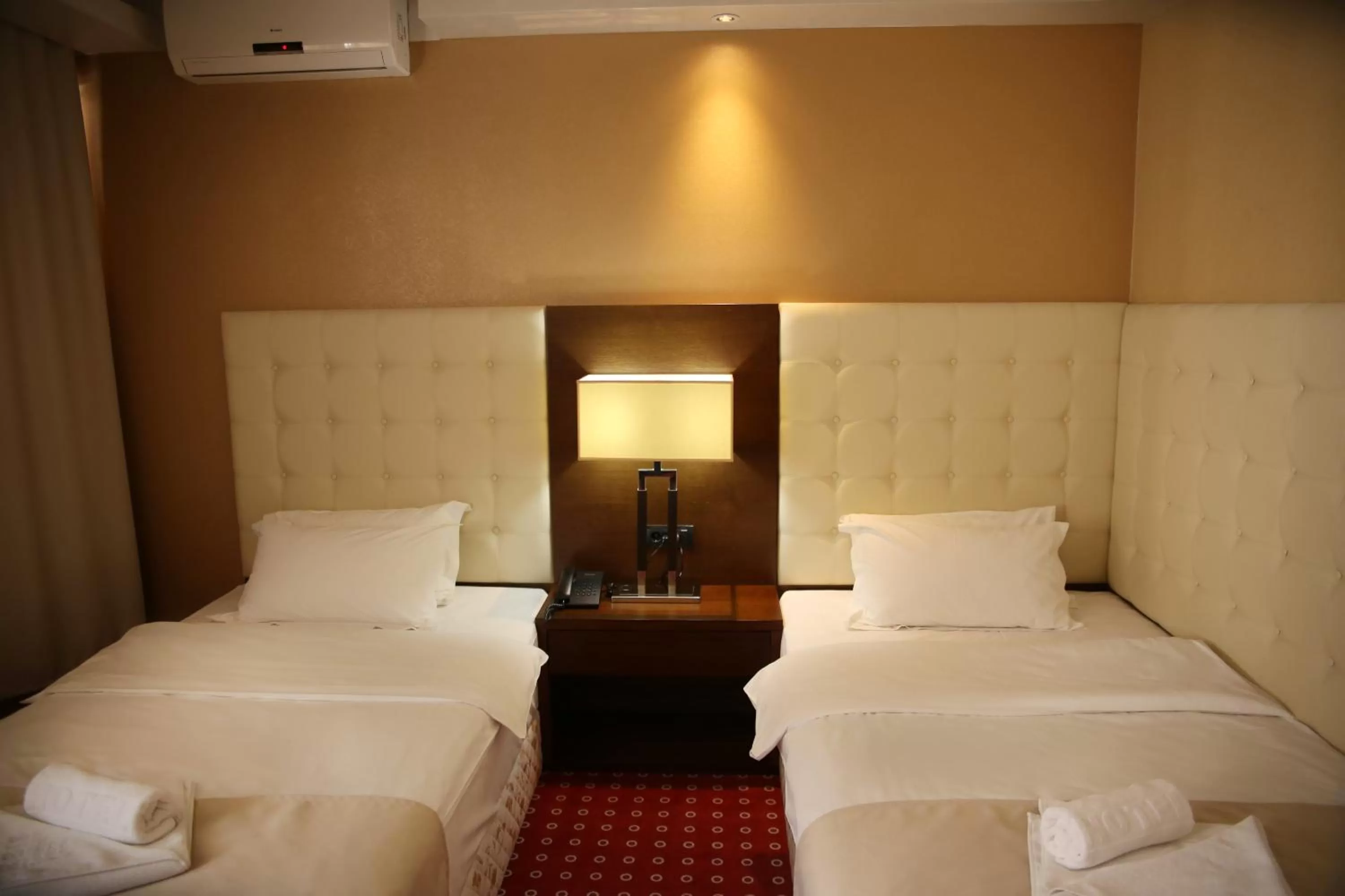 Bed in Orbis Design Hotel & Spa