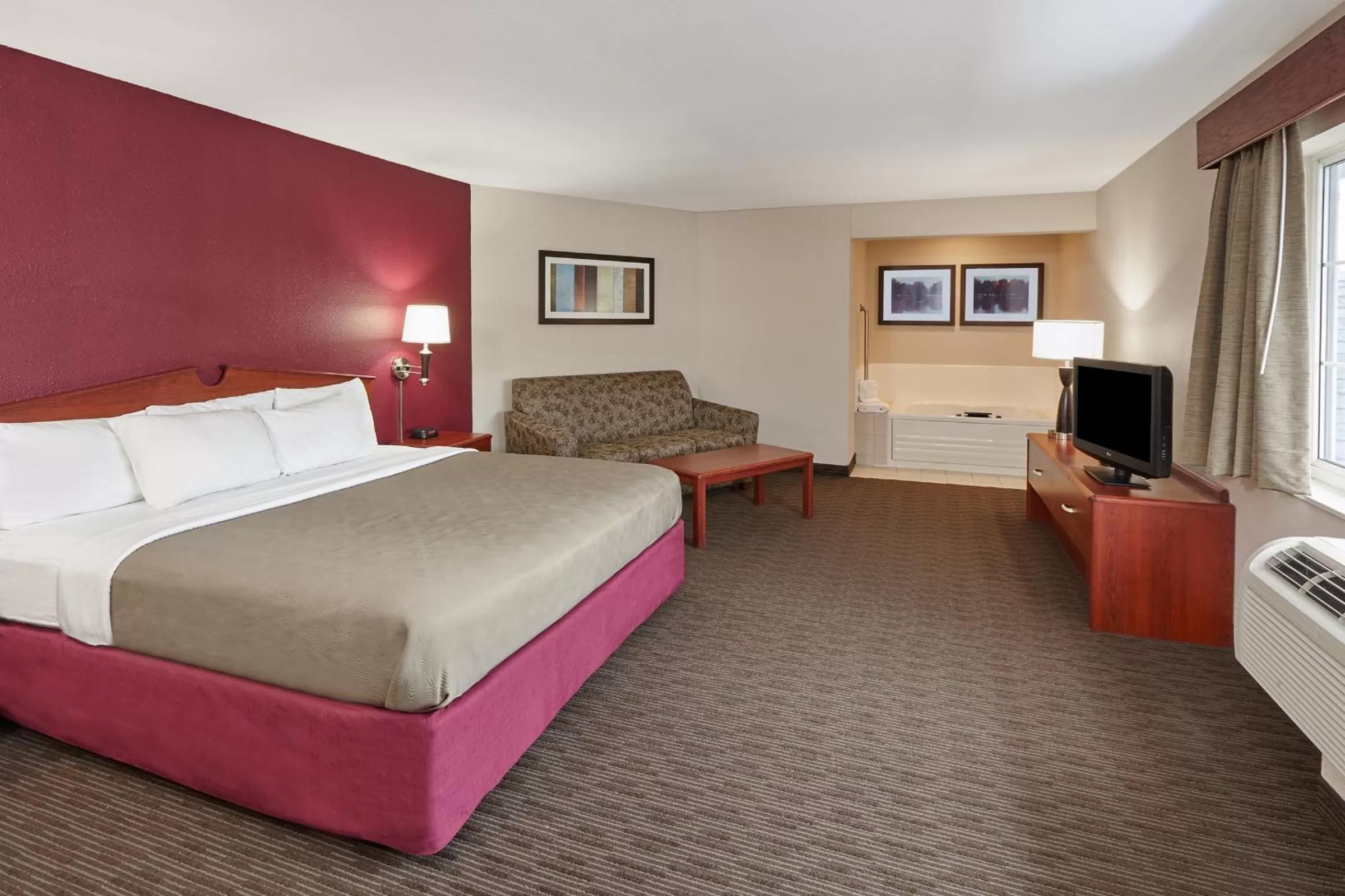 Bed in AmericInn by Wyndham Douglas/Saugatuck