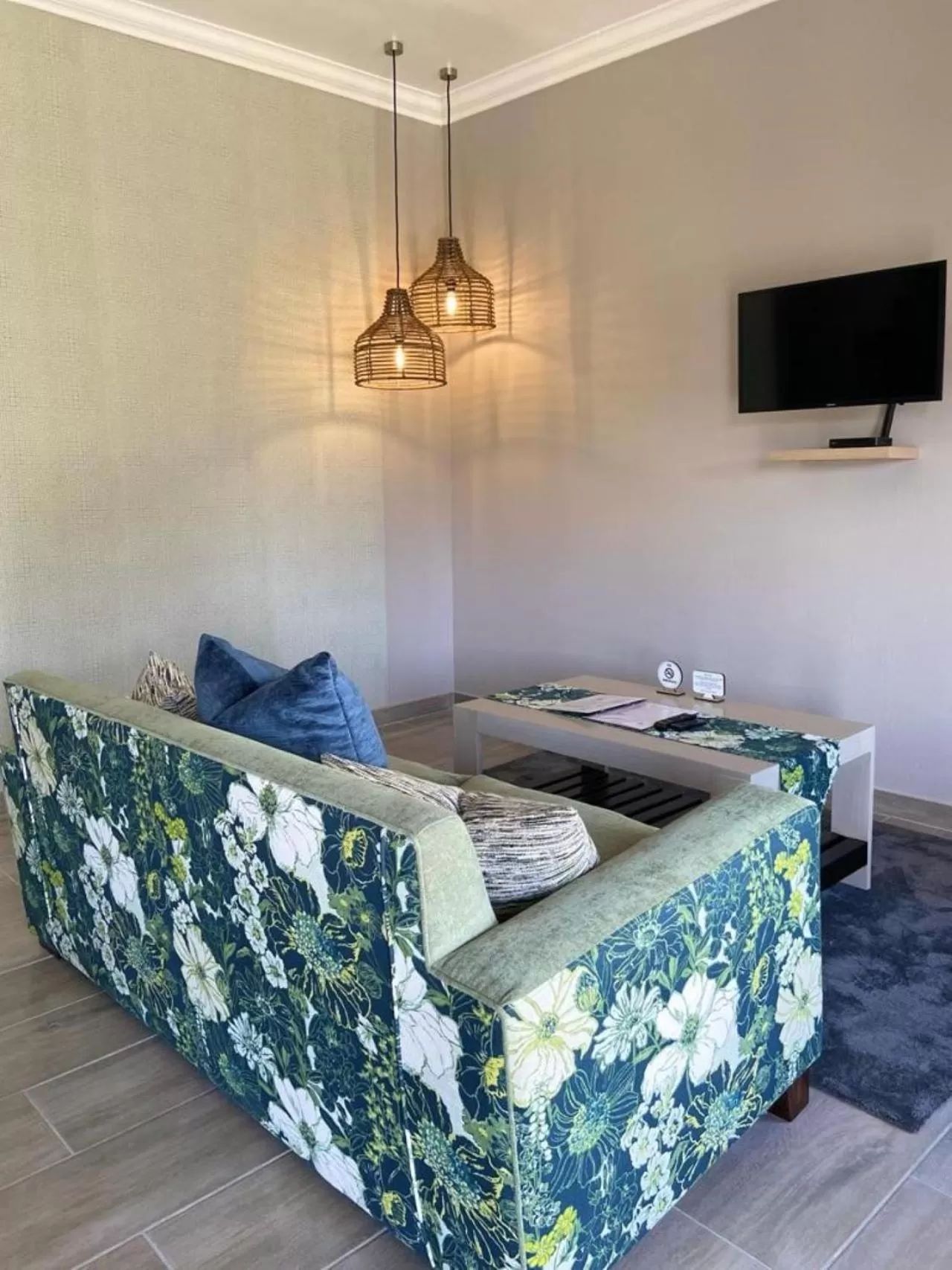 Communal lounge/ TV room in Nut Grove Boutique Hotel