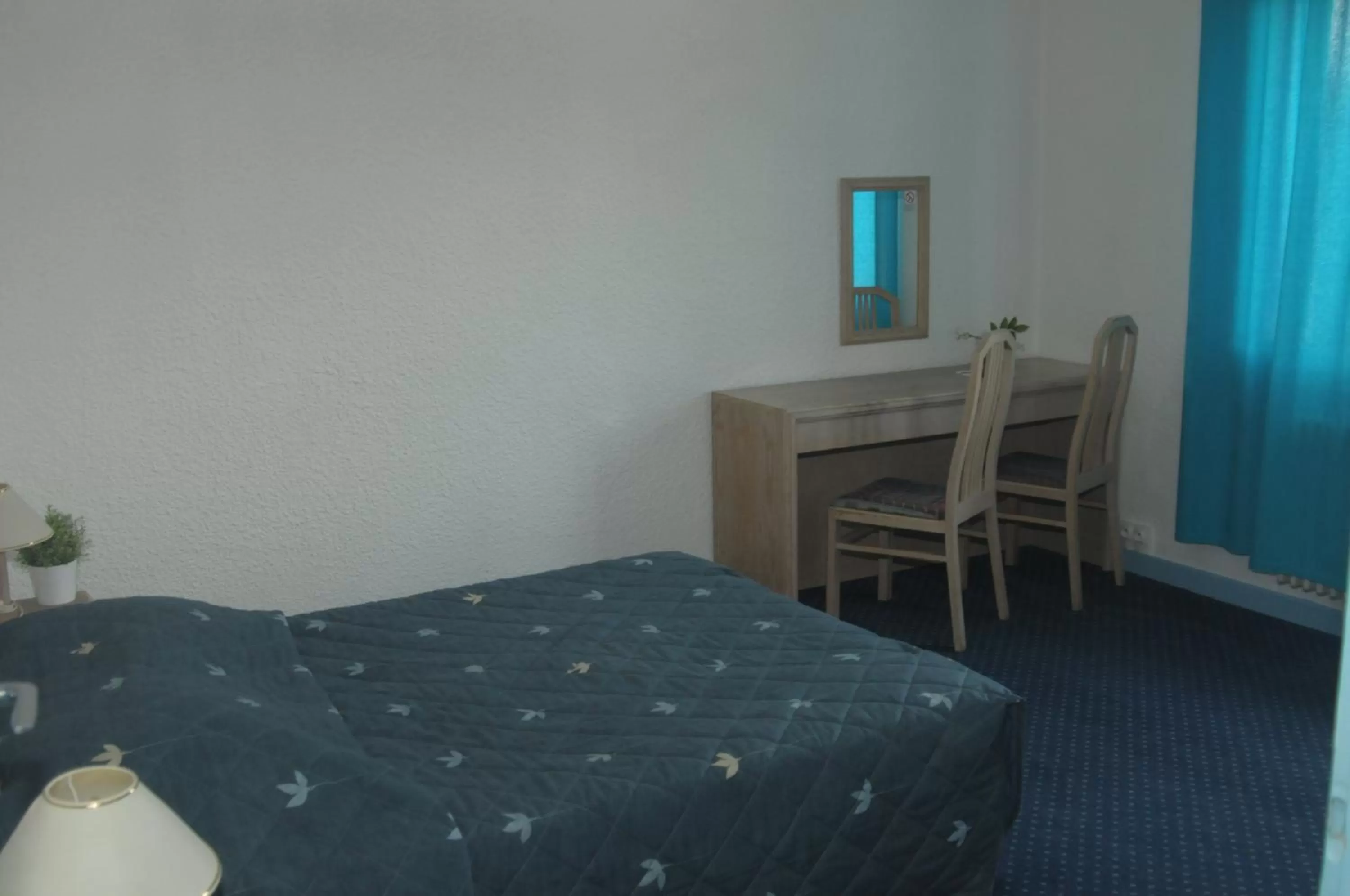 Photo of the whole room, Bed in Hôtel de La Poste