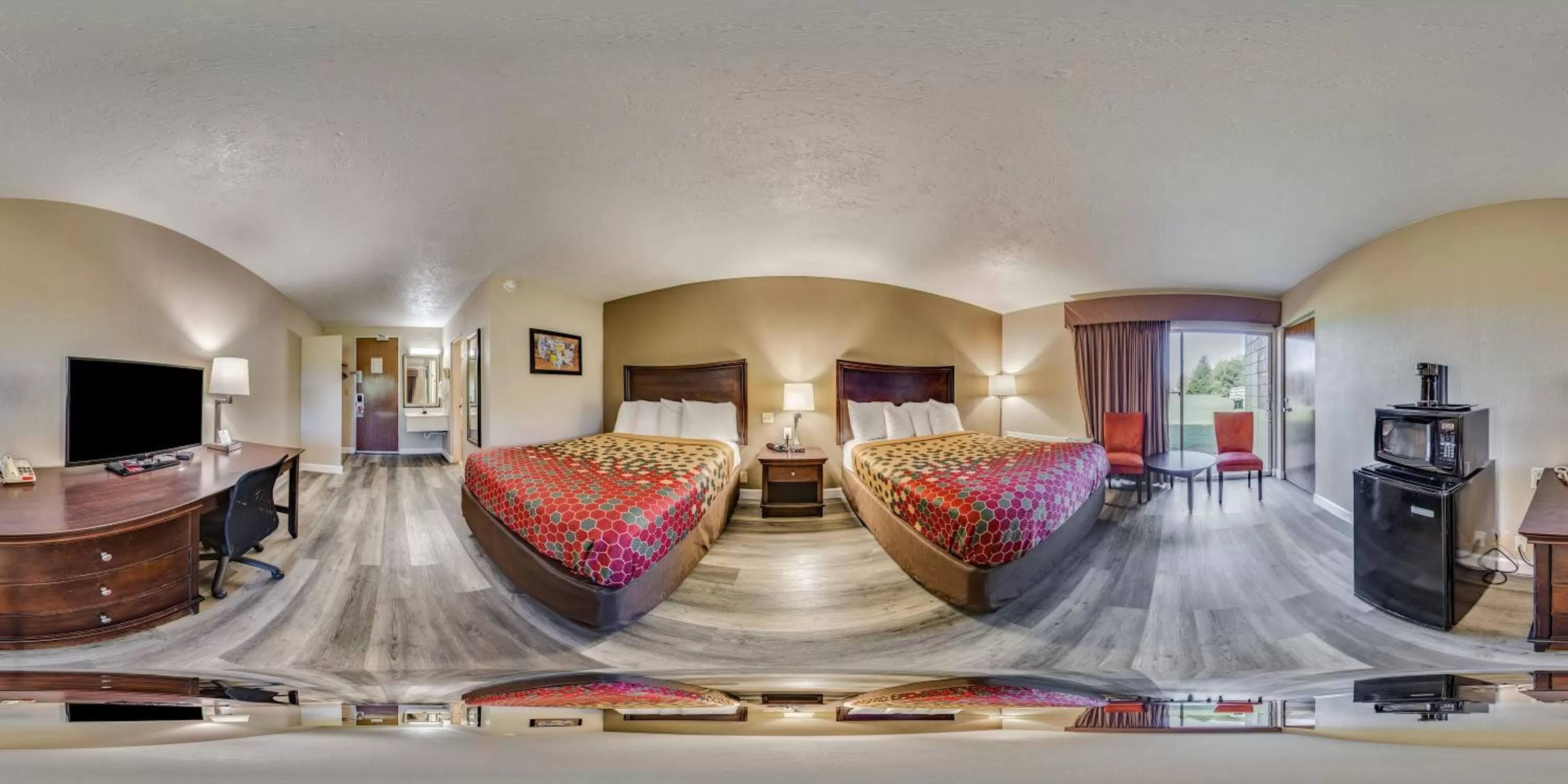 Photo of the whole room, Bed in Perry Inn & Suites By Capital O National Fairground GA I 75