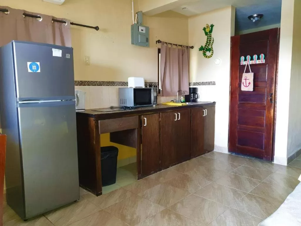 Kitchen/Kitchenette in Beach Side Condos Caye Caulker by CCVH