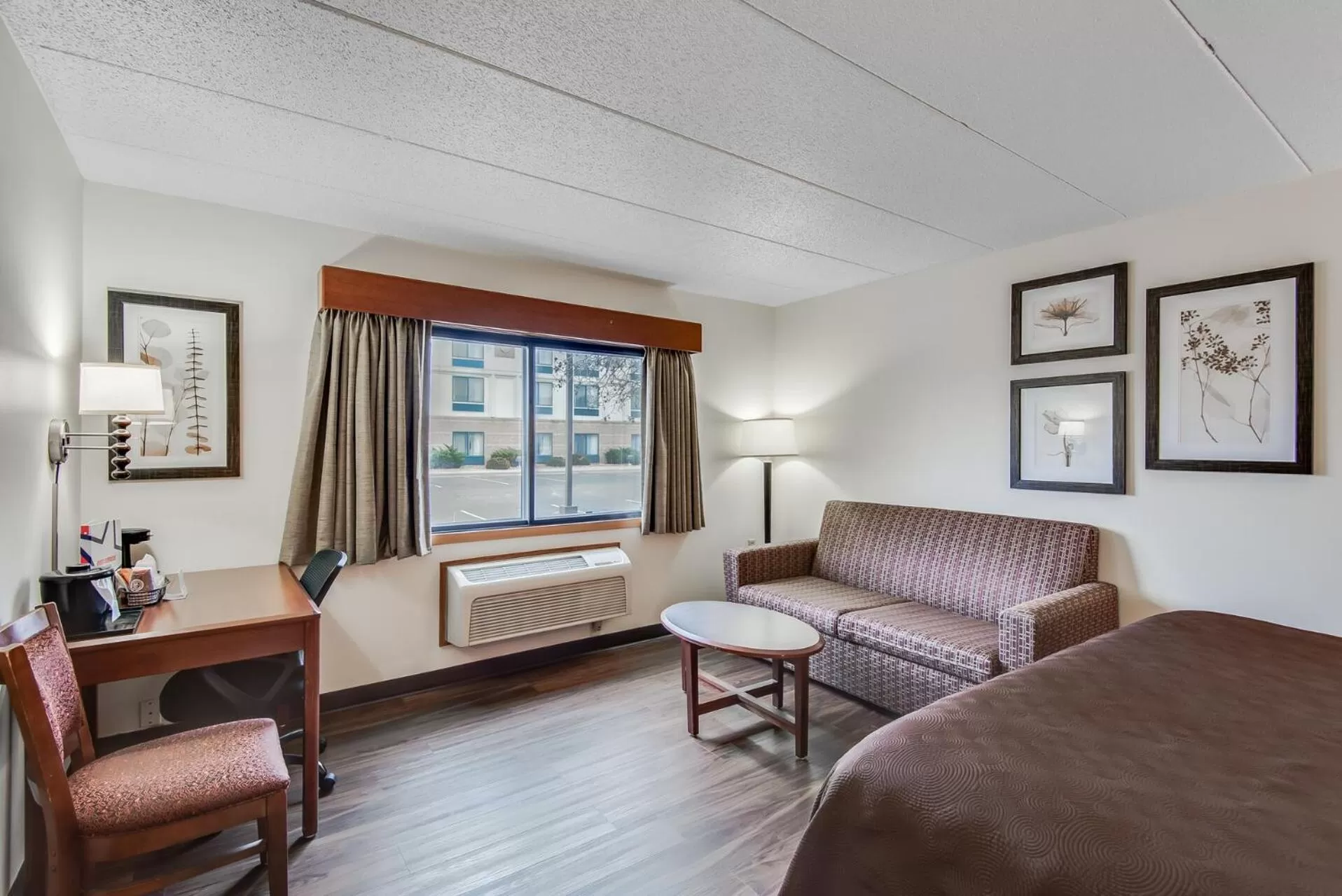 Bed in AmericInn by Wyndham Coon Rapids