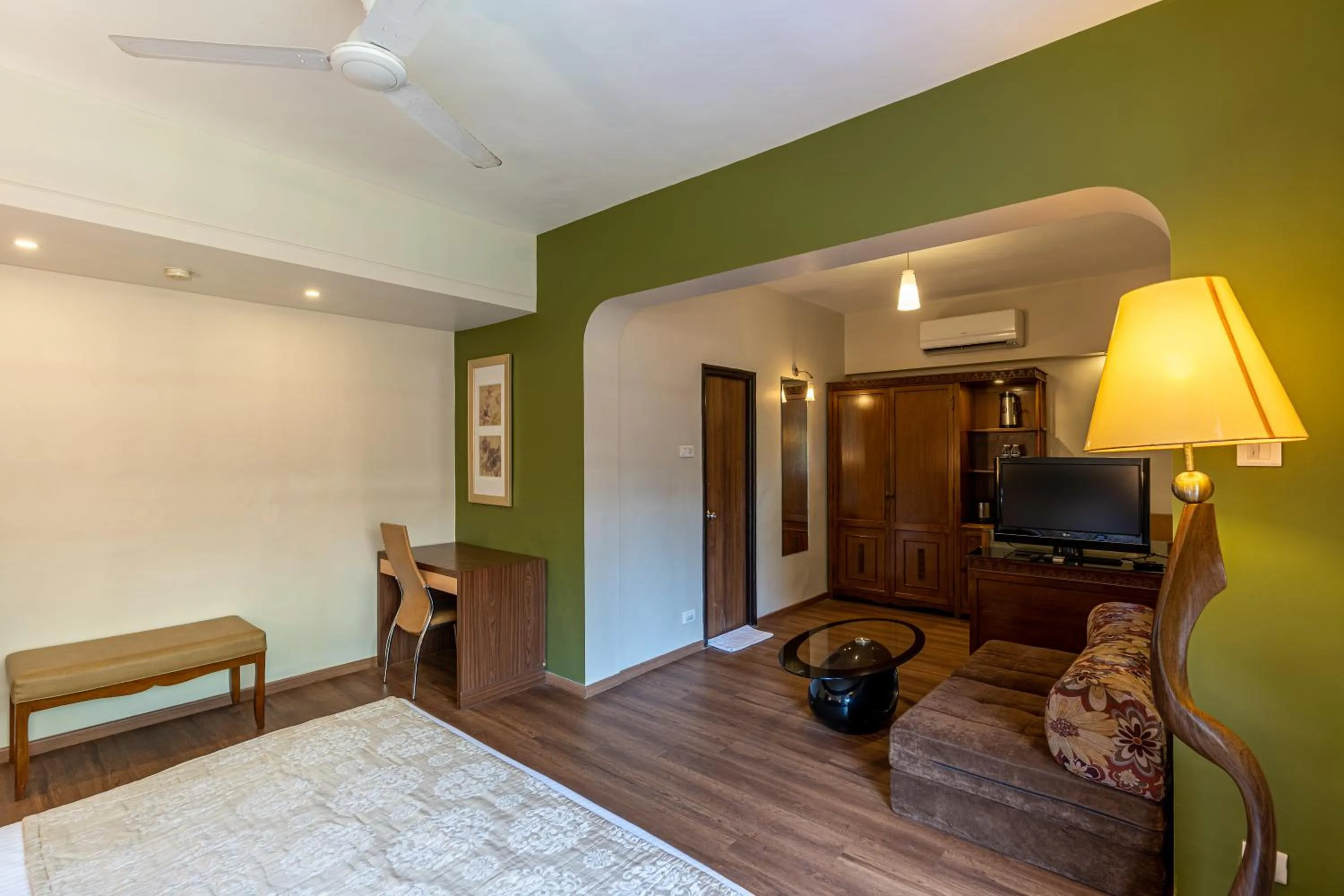 Living room, Bed in Neelam's The Grand Hotel Goa