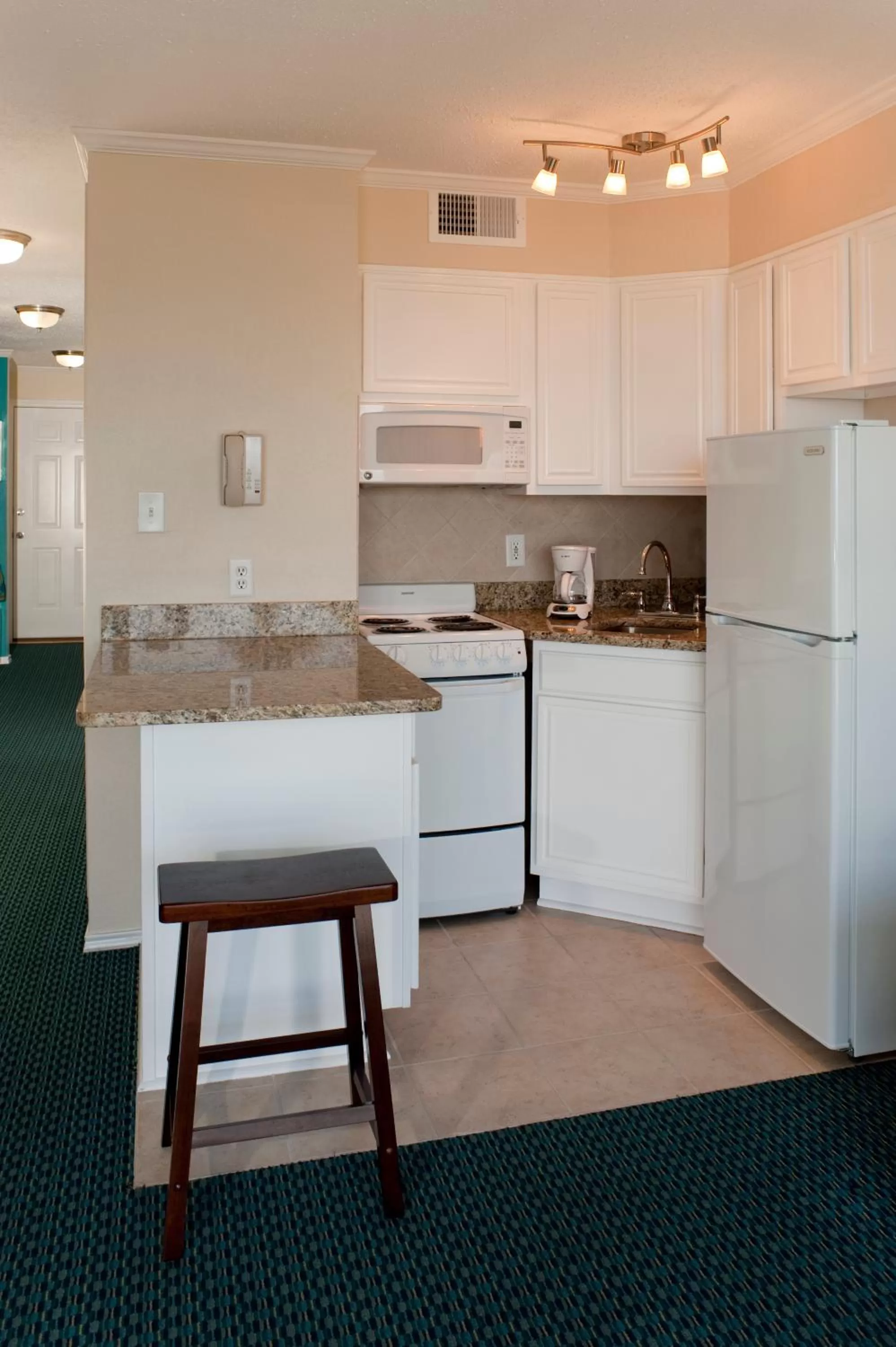 Kitchen or kitchenette in Casa Del Mar Beachfront Suites