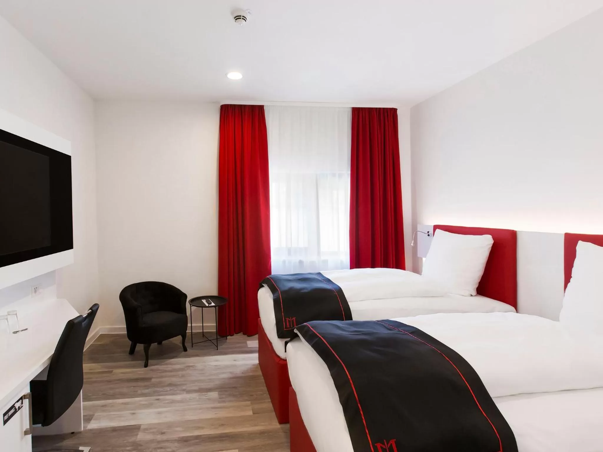 Bed in DORMERO Hotel Roth