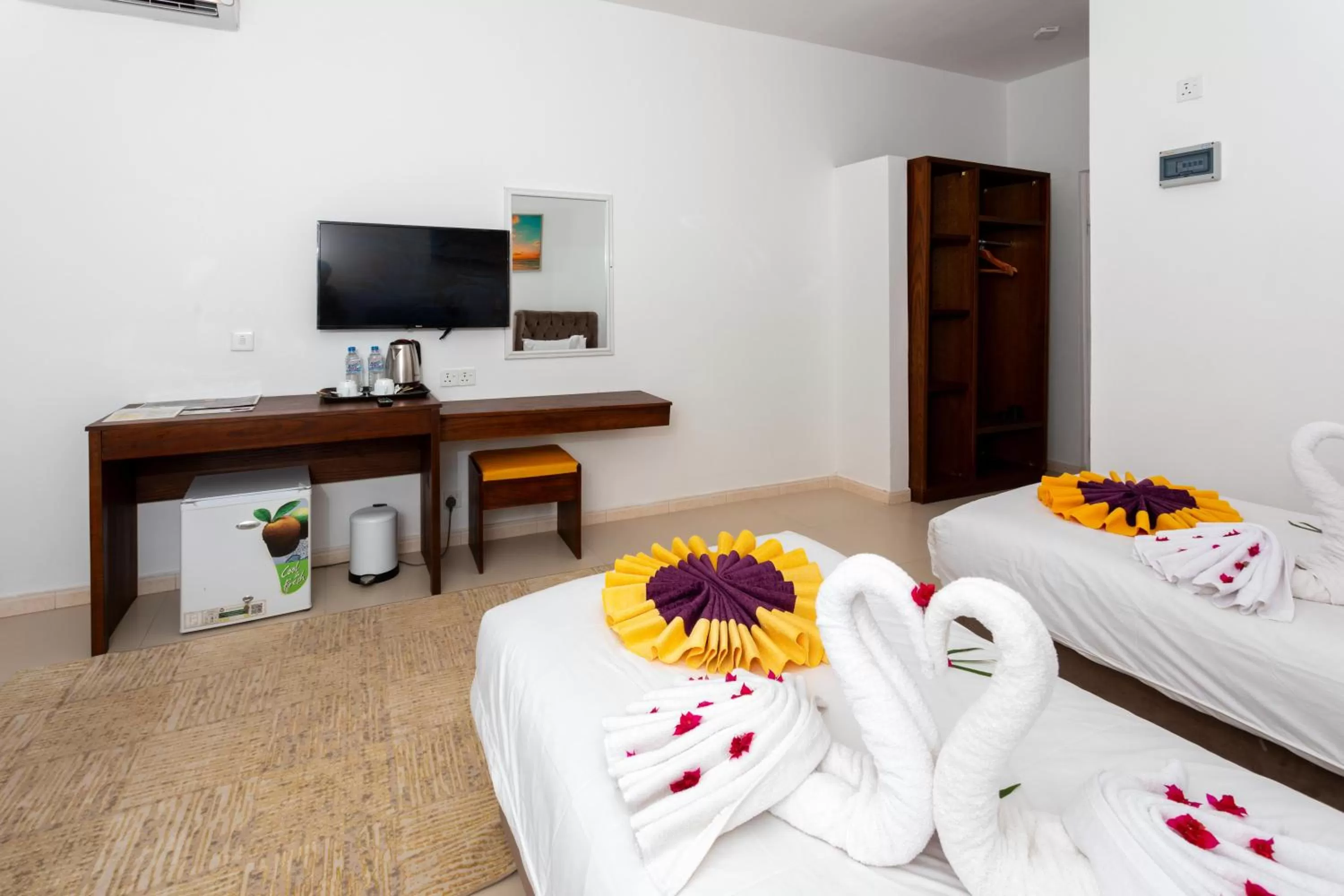 Bedroom, TV/Entertainment Center in Canary Nungwi Hotel & Free SPA