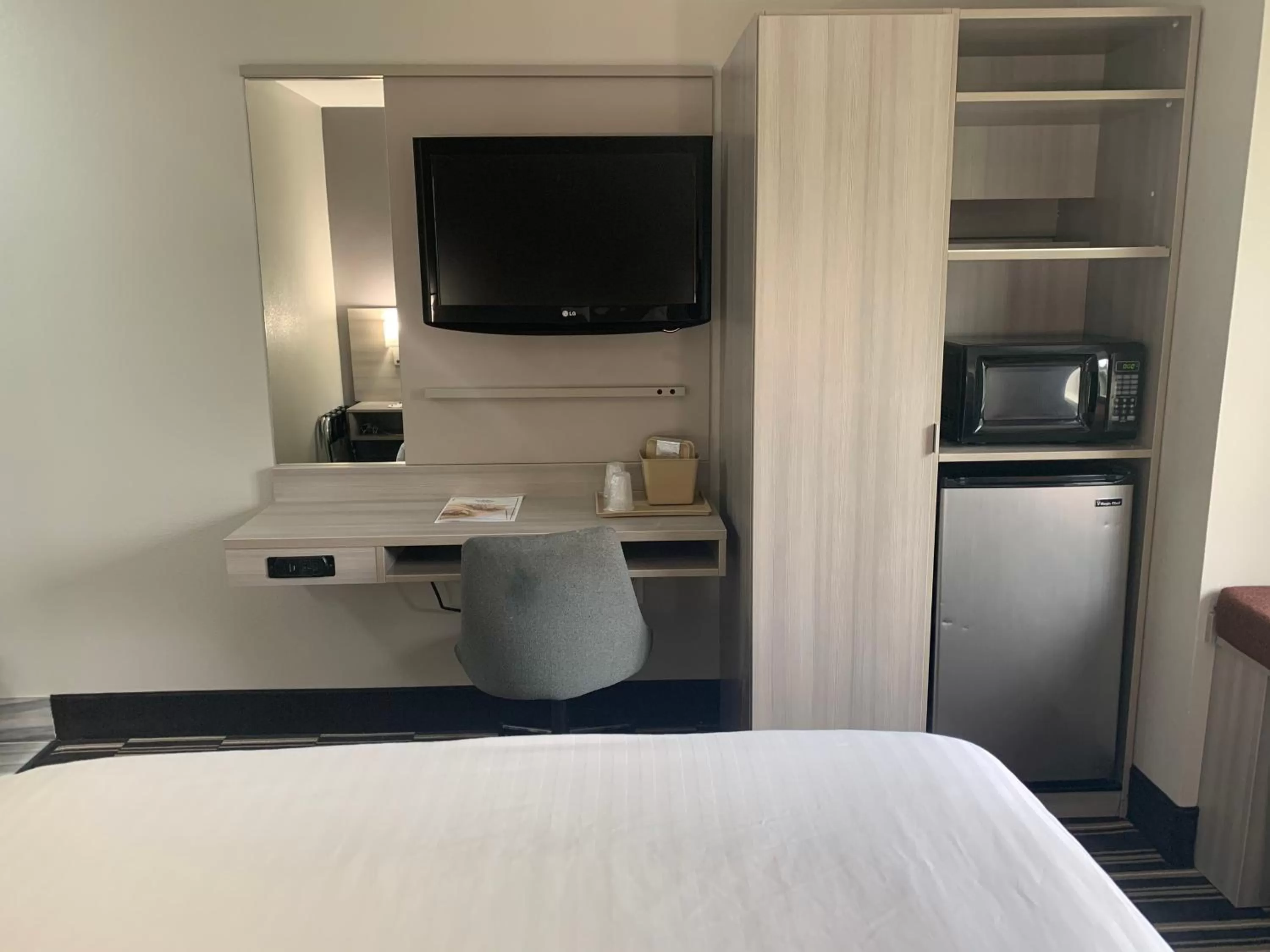 Bed in Microtel Inn by Wyndham Charlotte Airport