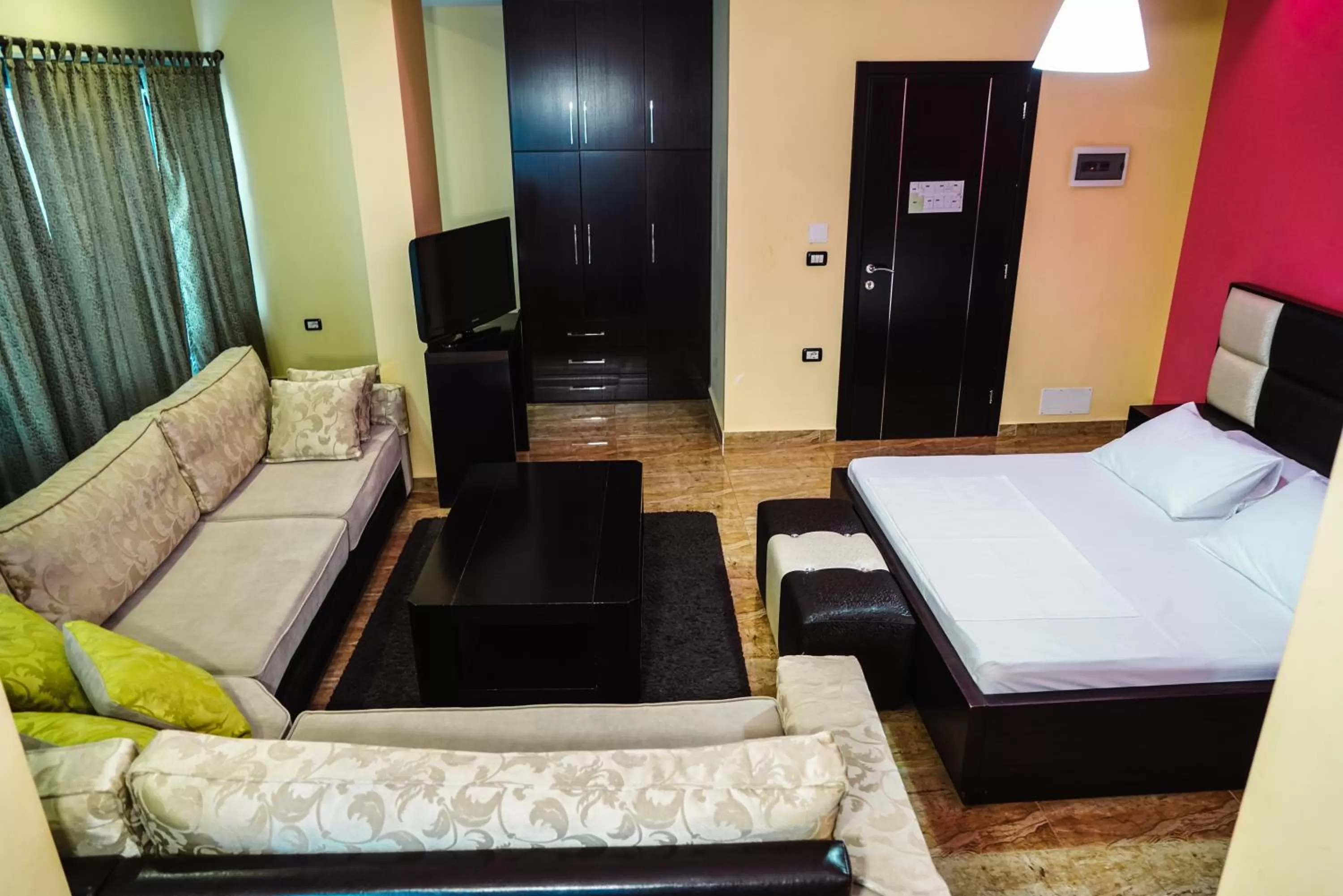 Bed, Seating Area in Hotel Magic