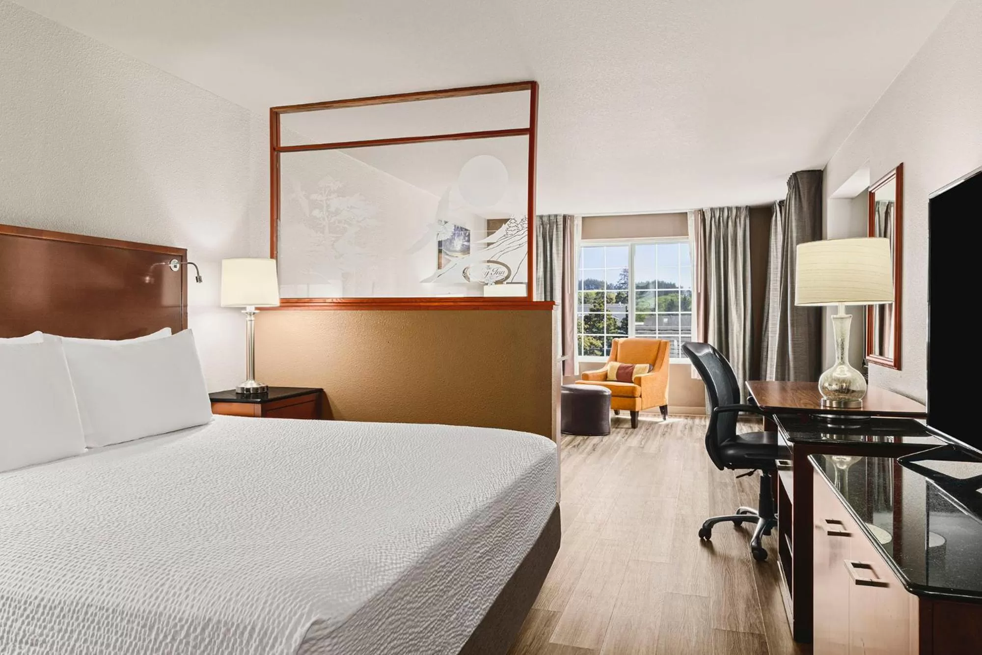 Bed in The Ashley Inn & Suites