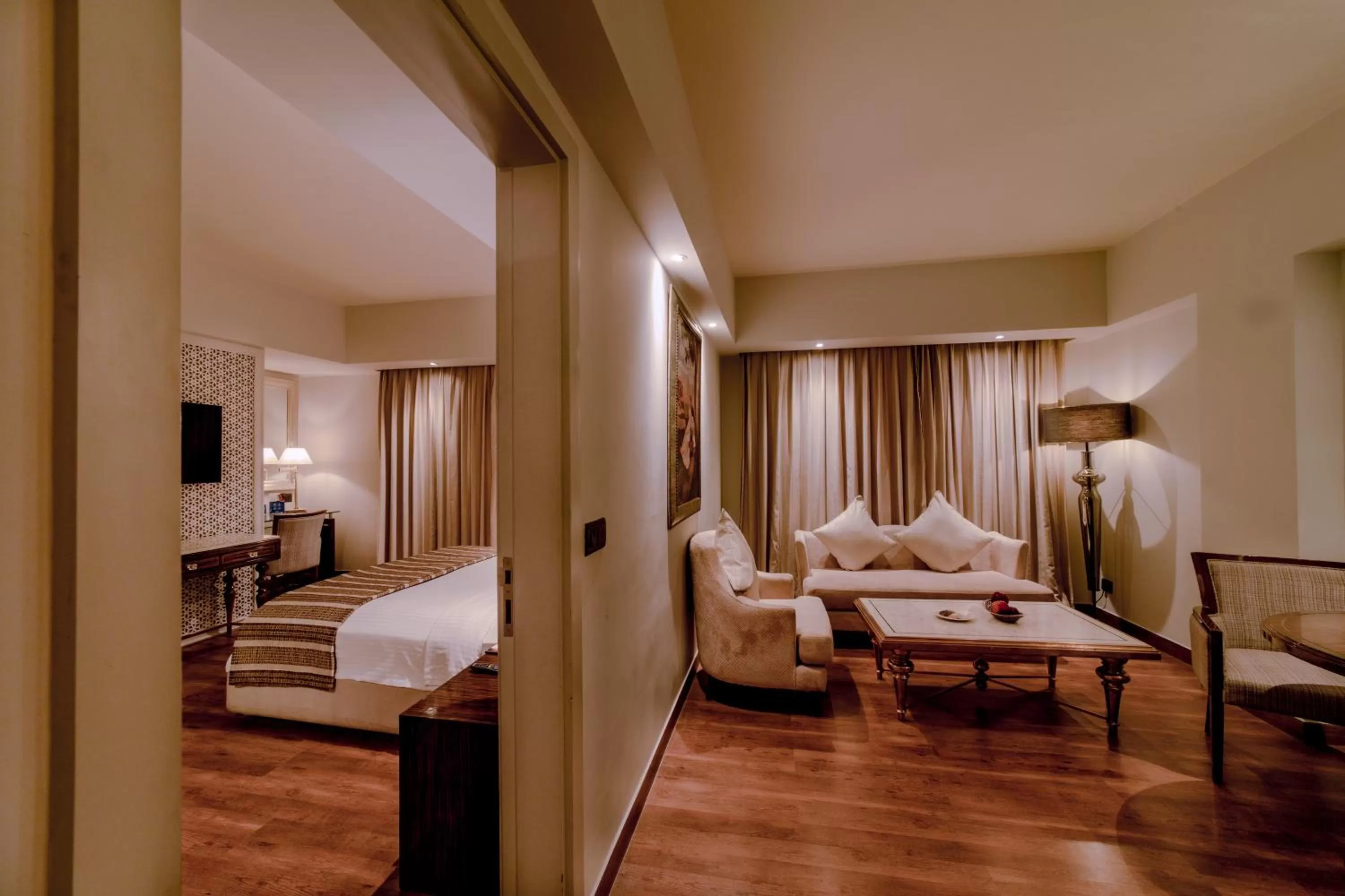 Living room, Bed in Sarovar Portico Jaipur