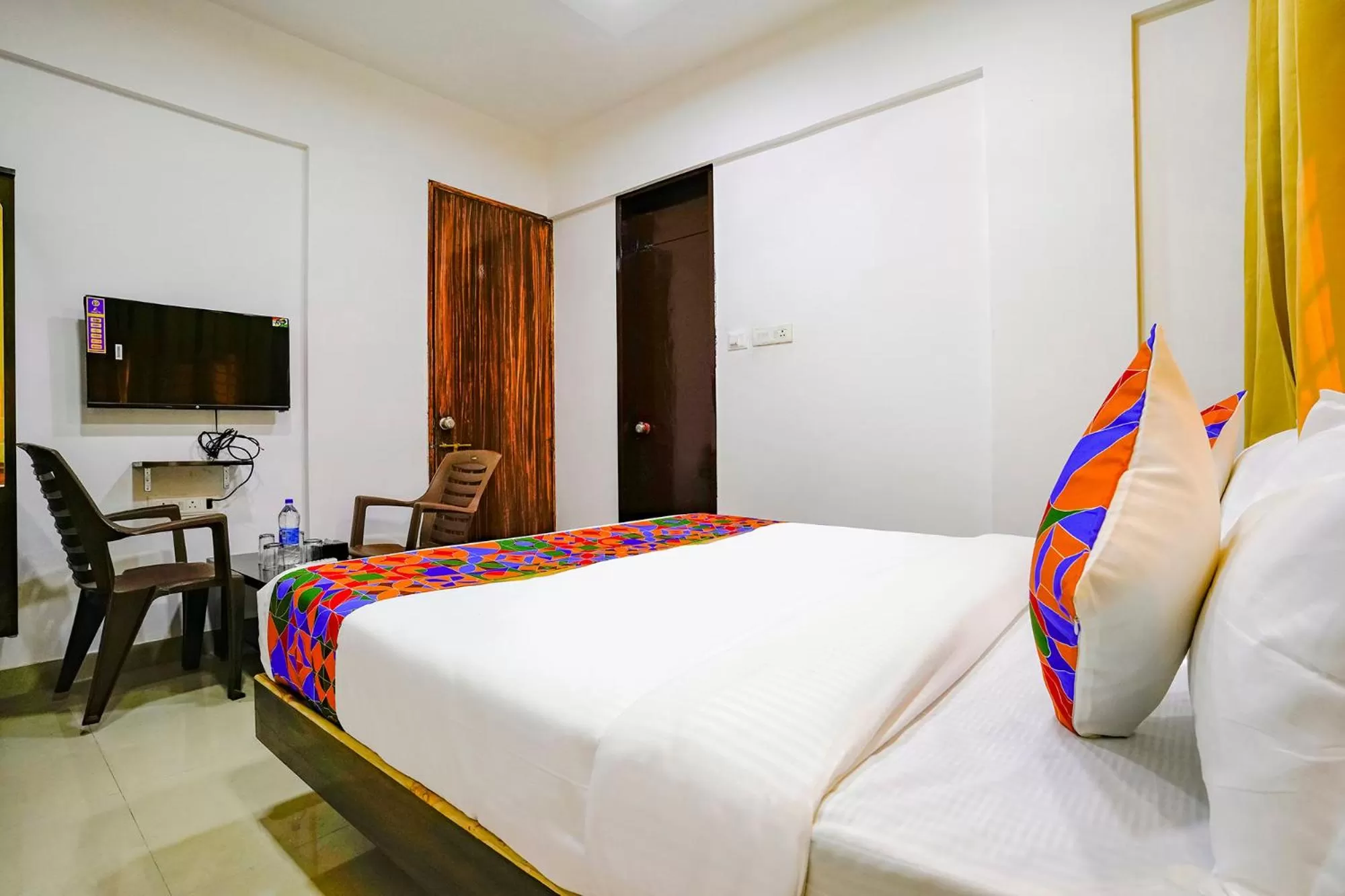 Bed in FabHotel Woods Regency