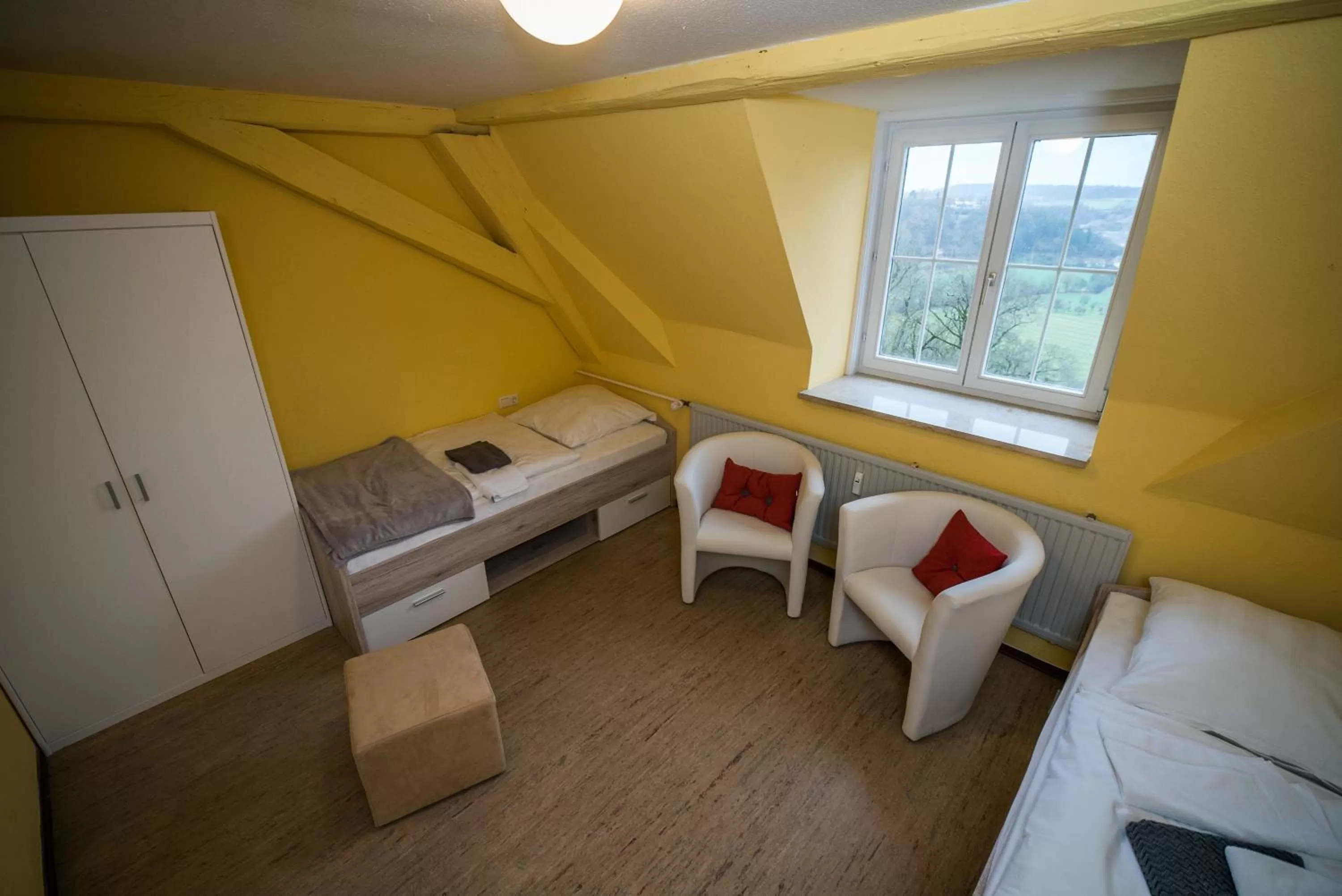 Photo of the whole room, Bed in BioHotel Schloss Kirchberg