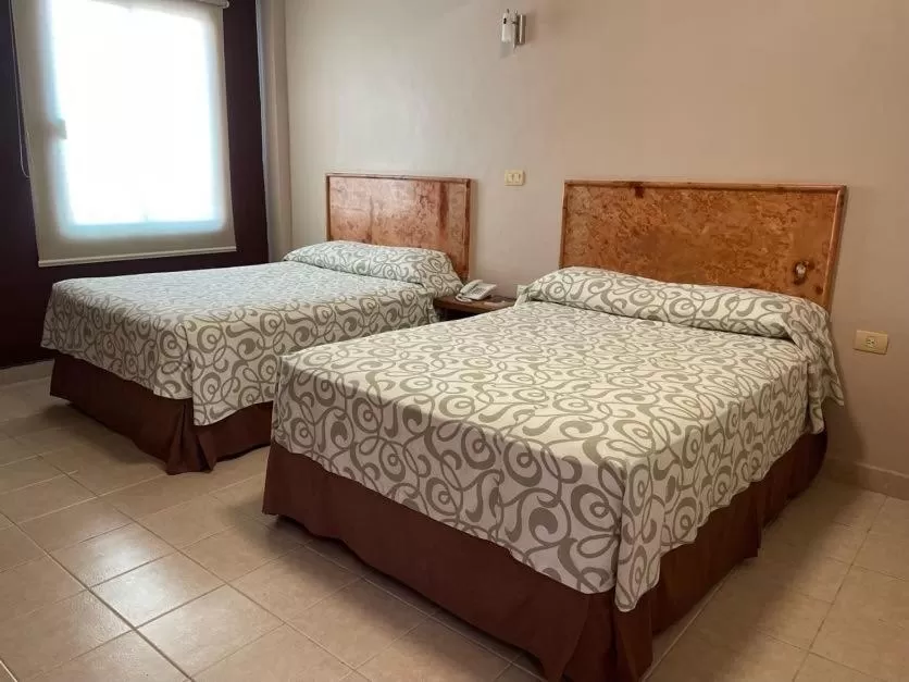 Bed in Hotel Santo Domingo Express