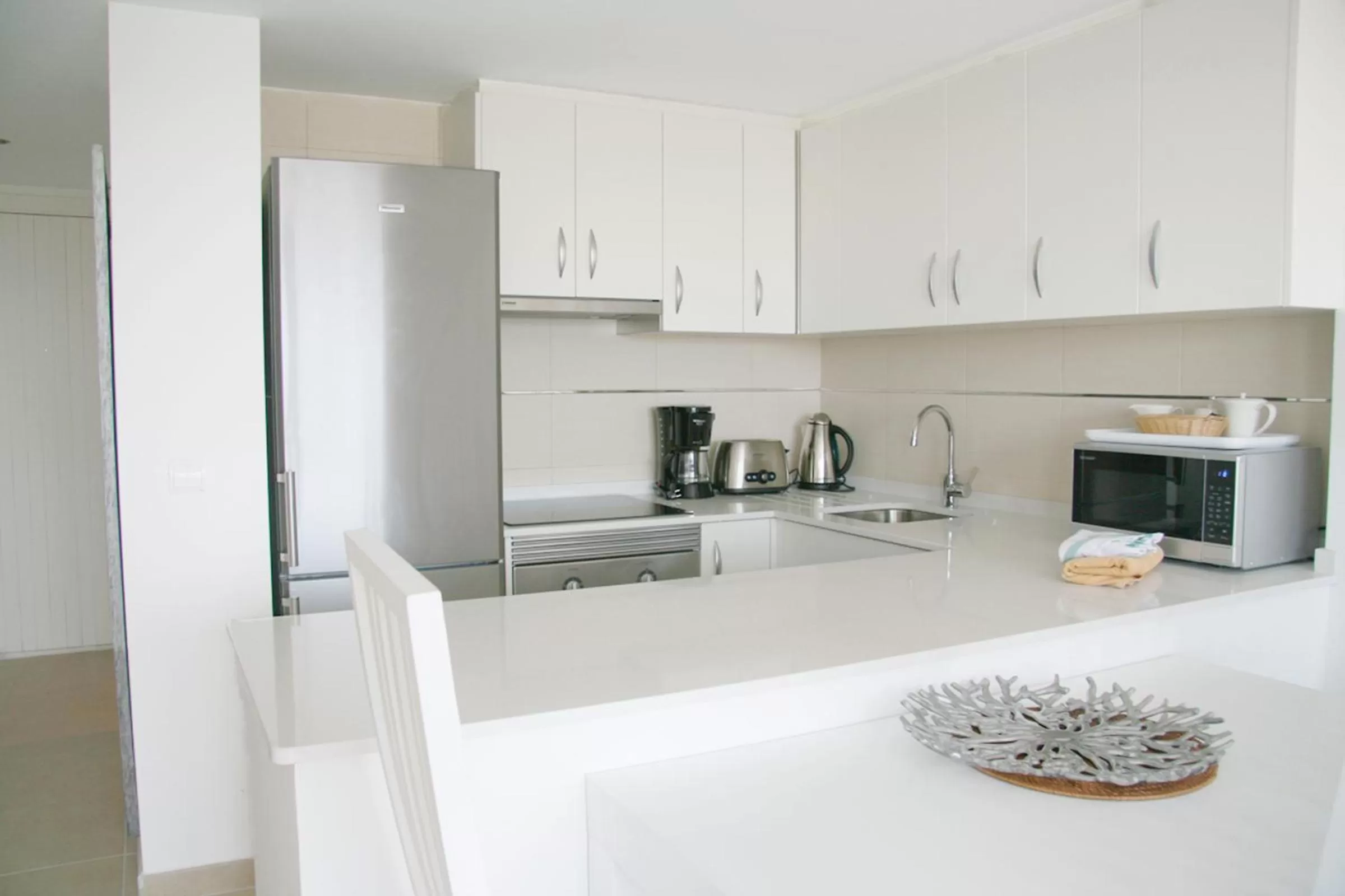 Kitchen or kitchenette in Camelina Suites