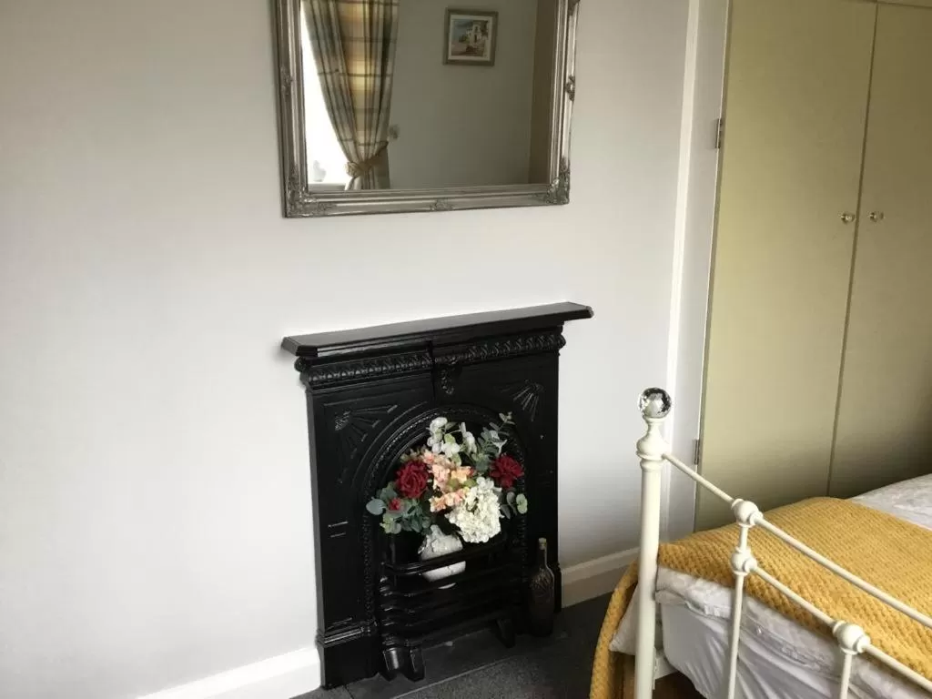 Bed in TRETHEWEY GUEST HOUSE