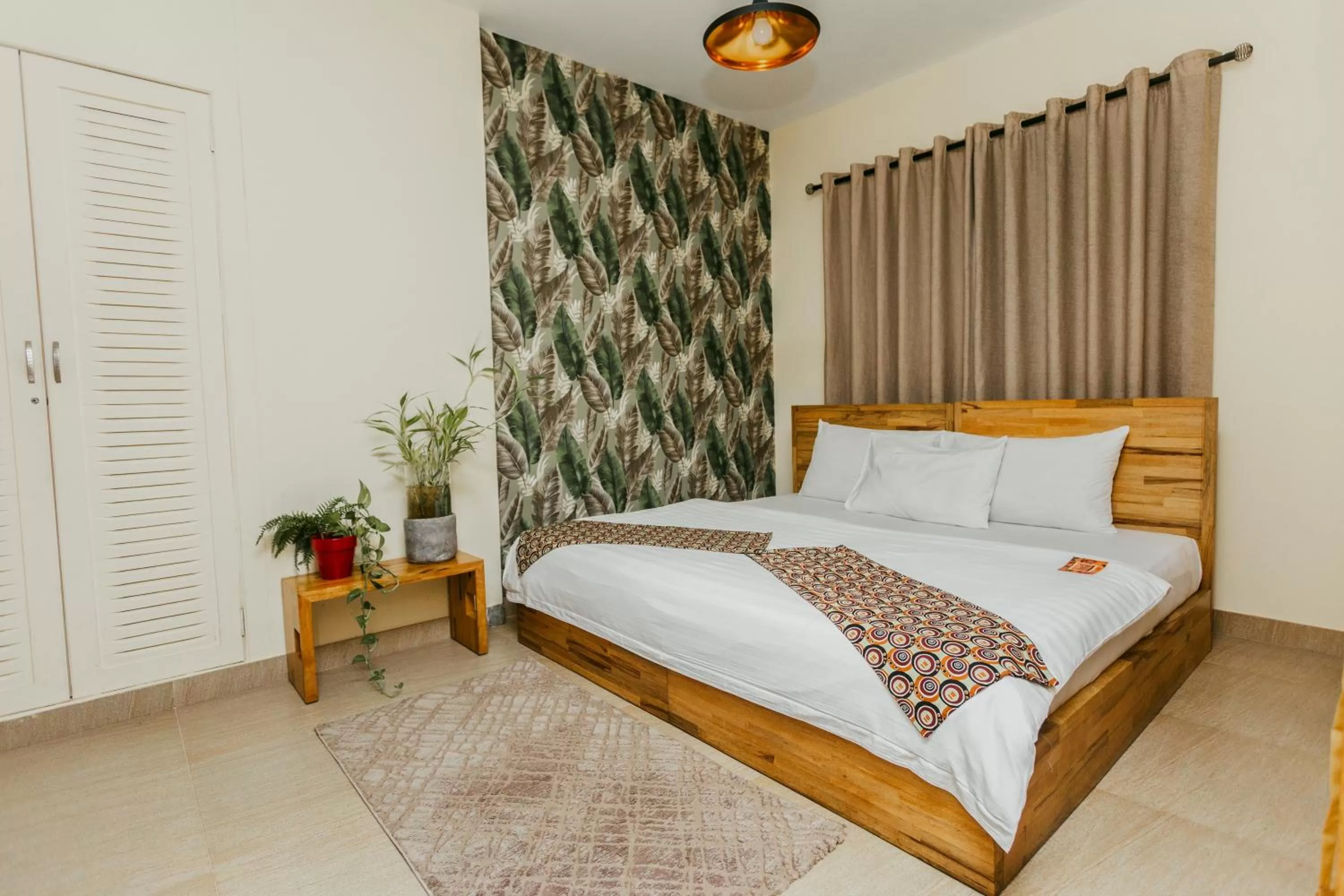 Bed in Roots Hotel Apartment