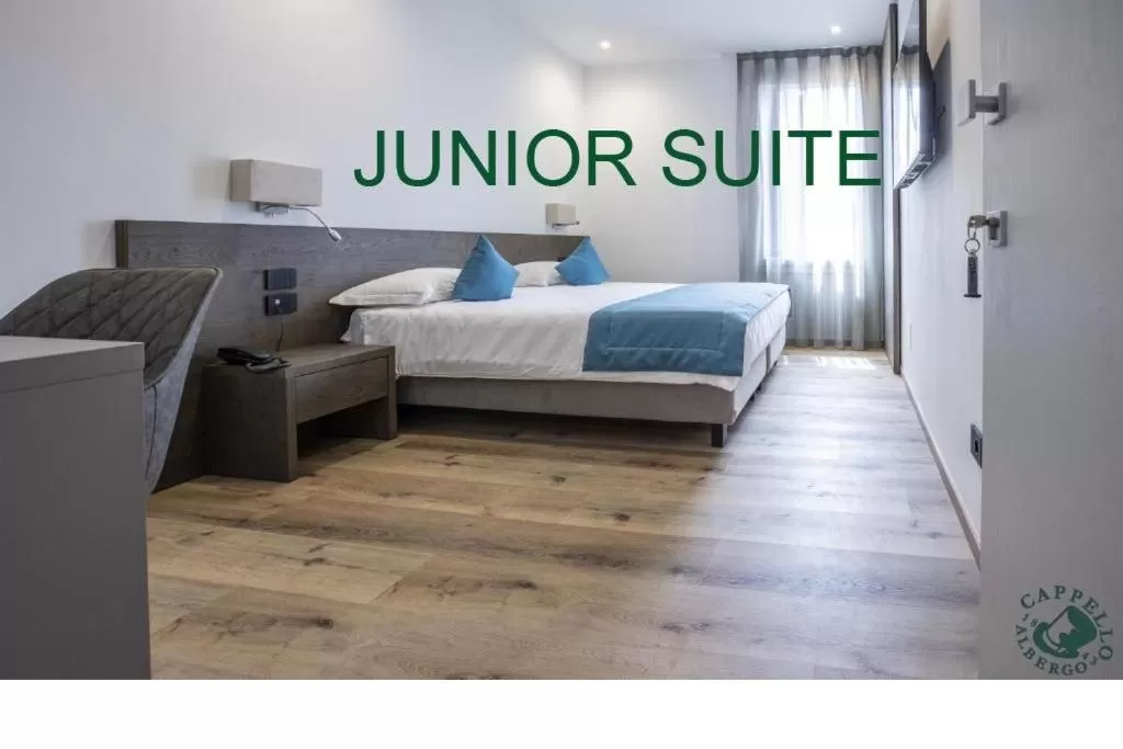 Bed in Albergo Cappello e Cadore