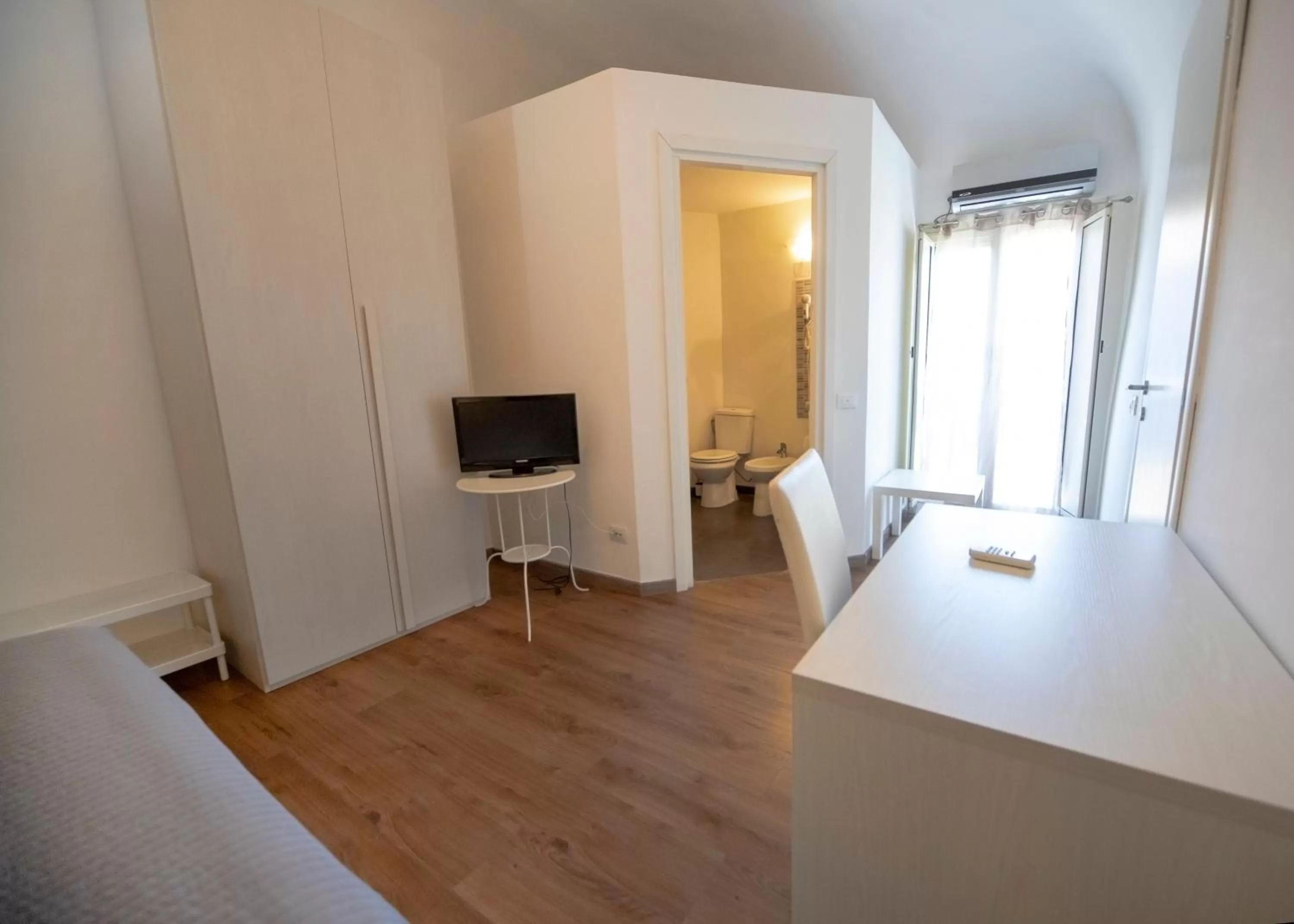 Photo of the whole room, TV/Entertainment Center in Zurria Rooms