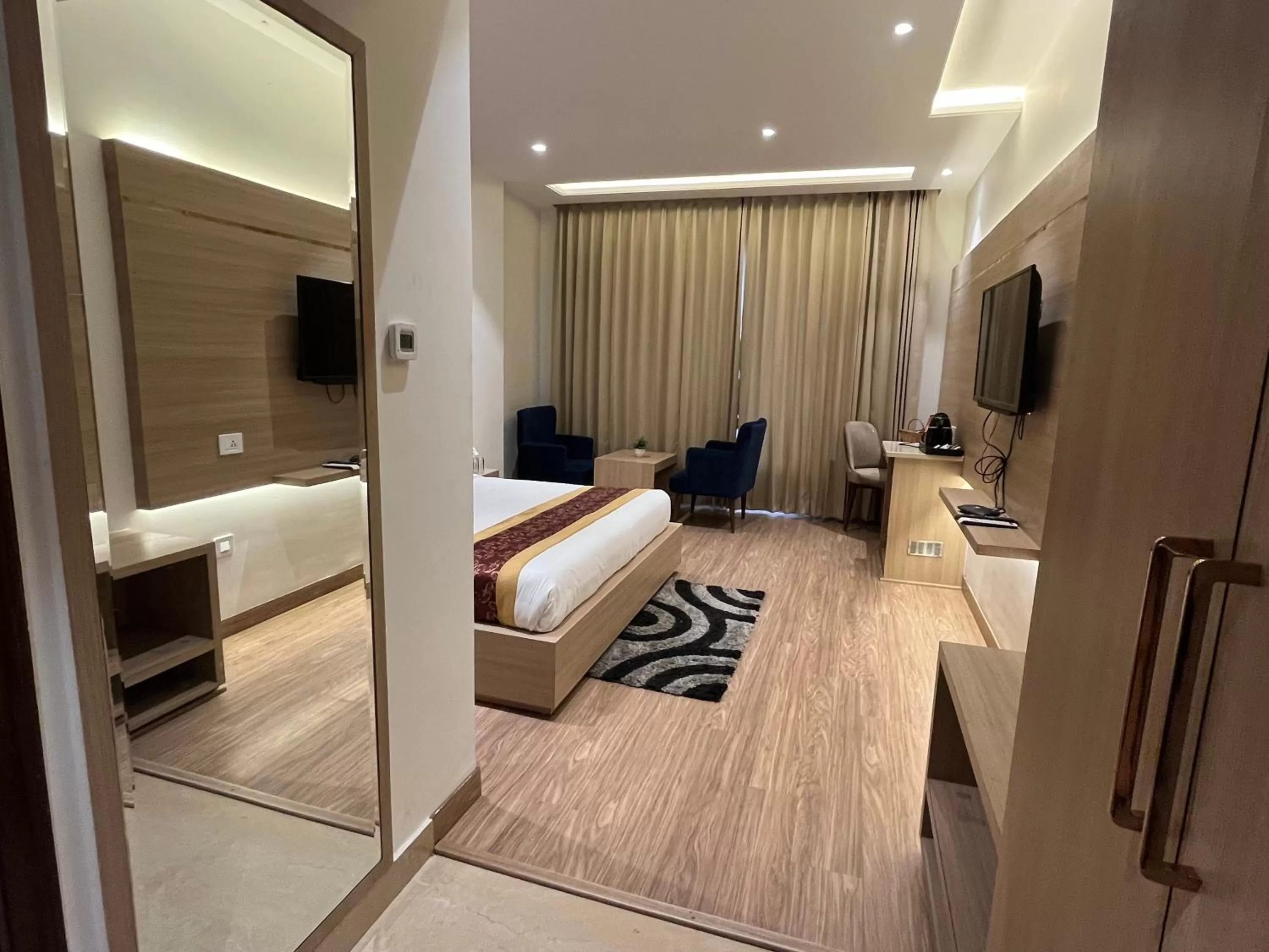 Photo of the whole room, Bed in RRV Hotel