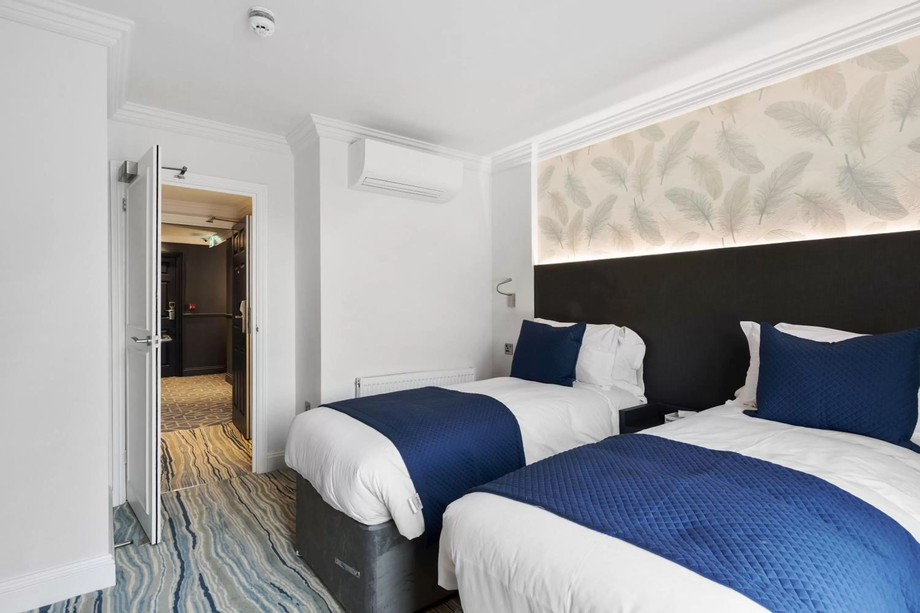 Bed in Commodore Hotel