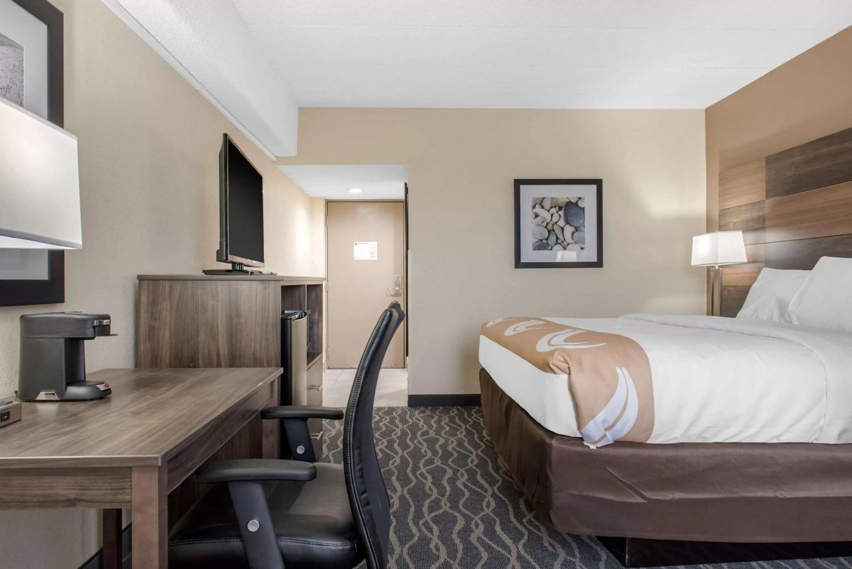 Bed in Quality Inn and Conference Center