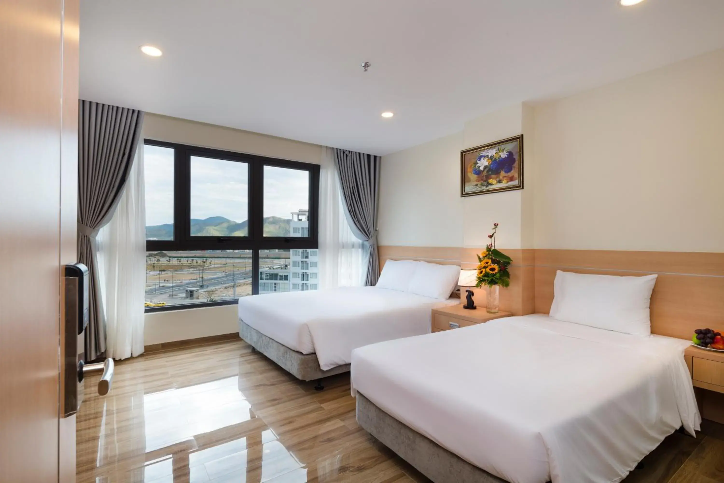 Deluxe Triple Room with City View in The Swan Nha Trang Hotel Deluxe Triple Room with City View in The Swan Nha Trang Hotel