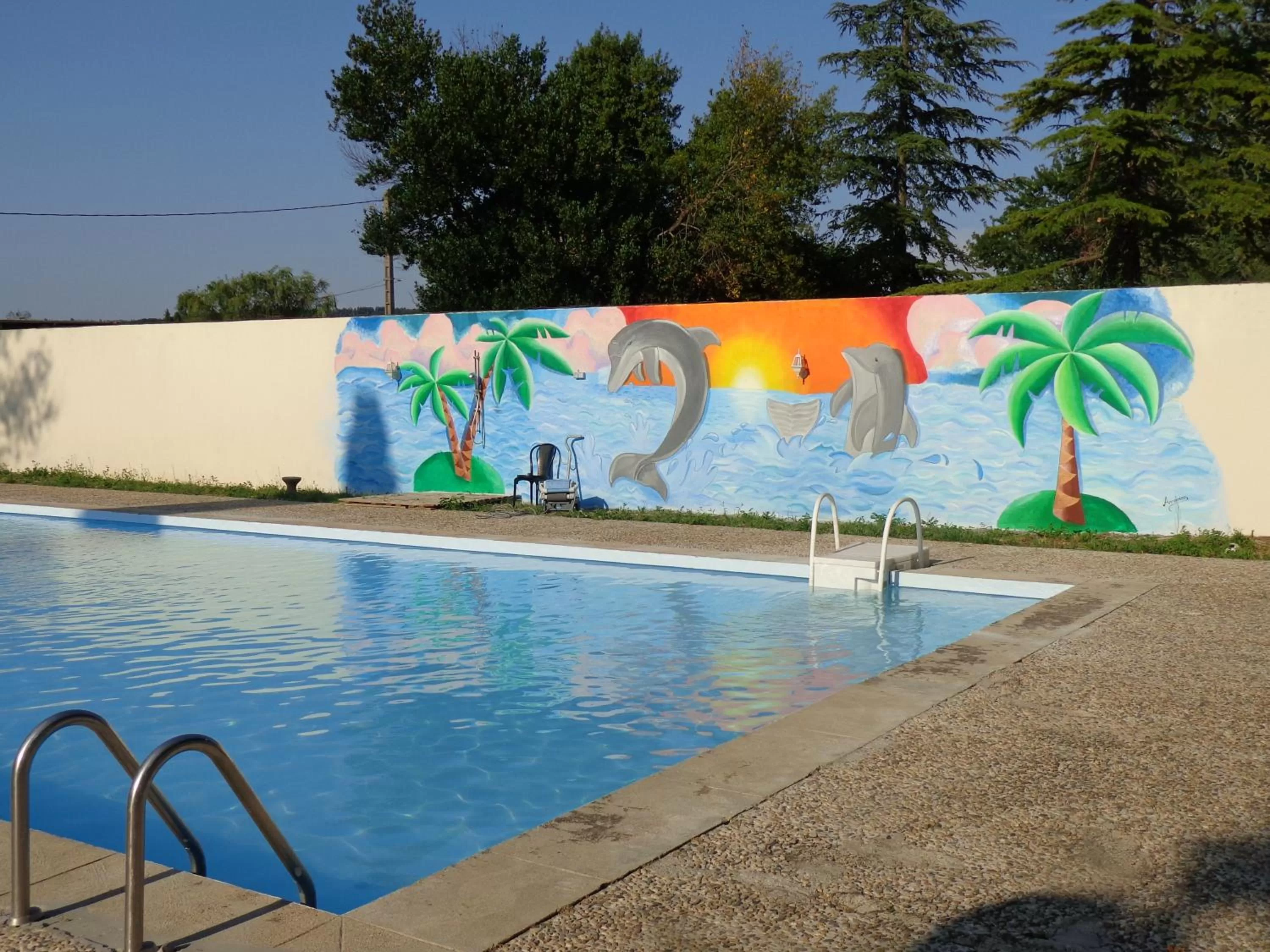 Swimming pool in Le Relais de la RN7