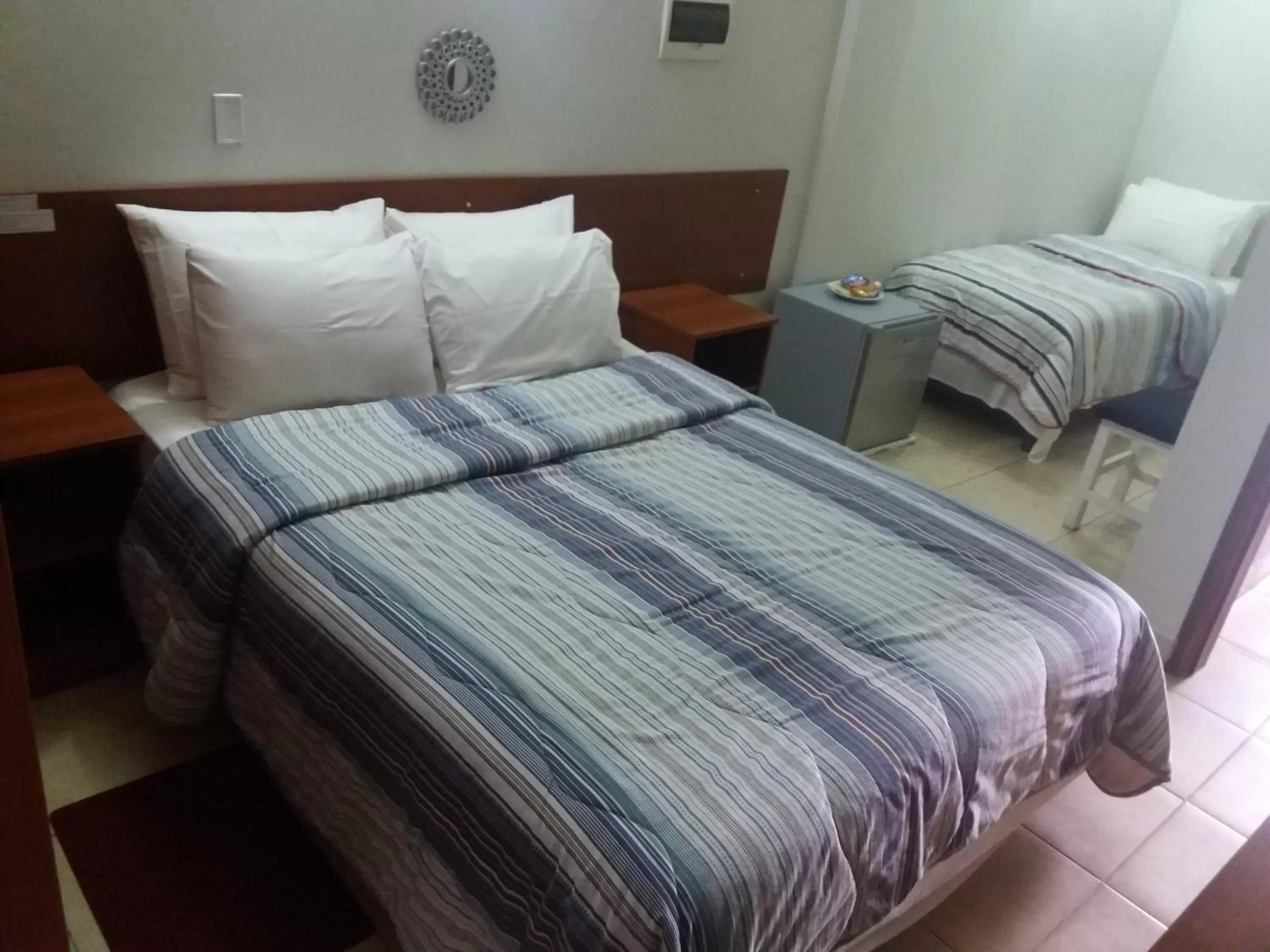 Bed in Madame Lynch Hotel Boutique