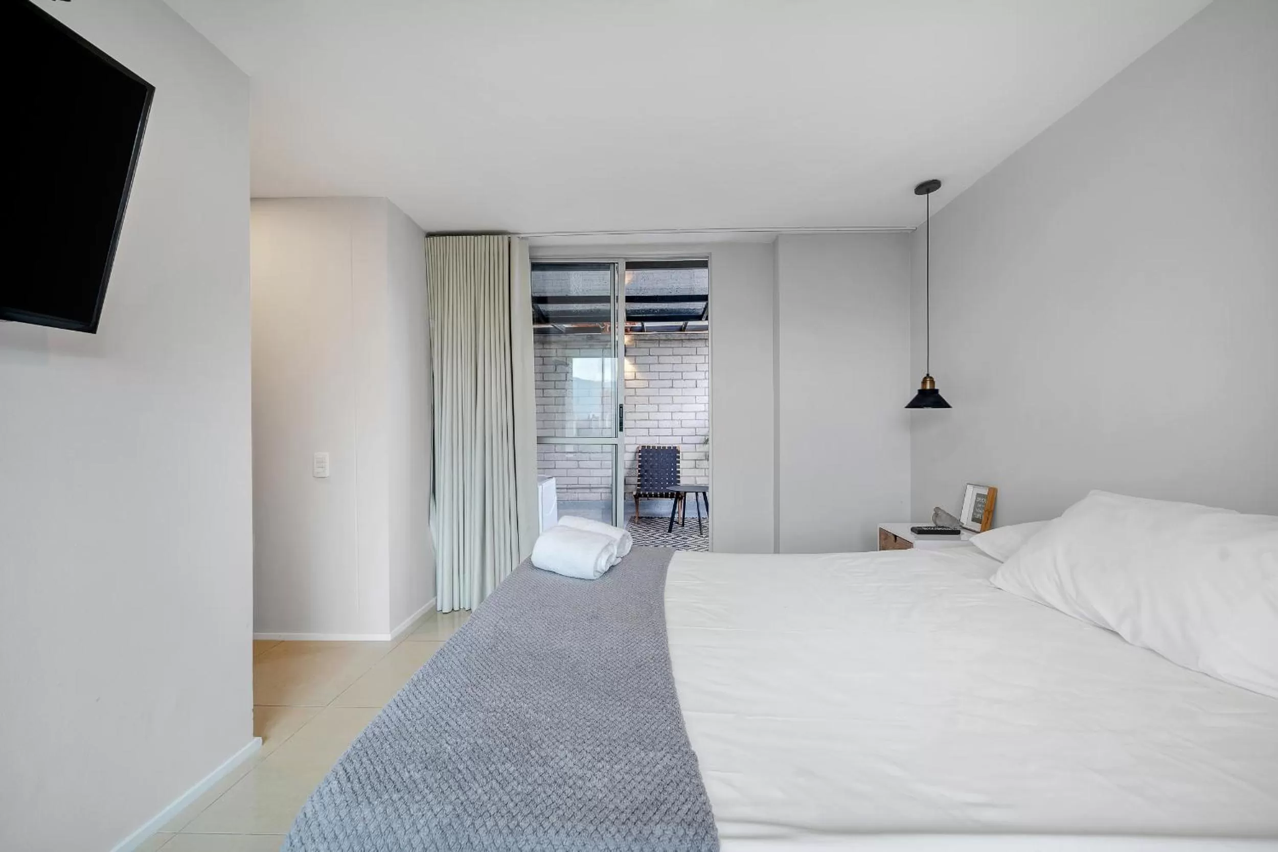 Bedroom, Bed in Apartamentos Poblado Alejandría by HOUSY HOST