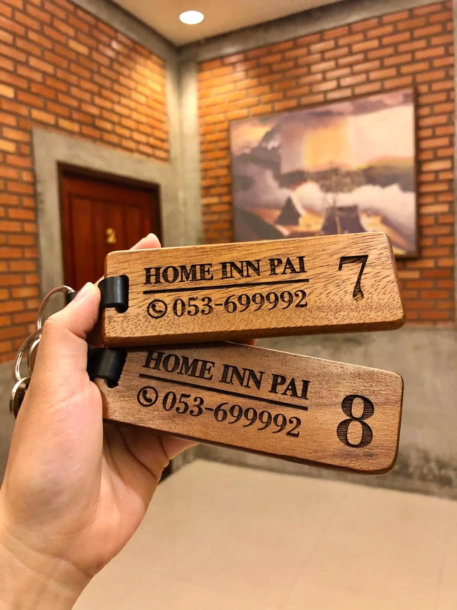 Property logo or sign in Home Inn Pai Garden