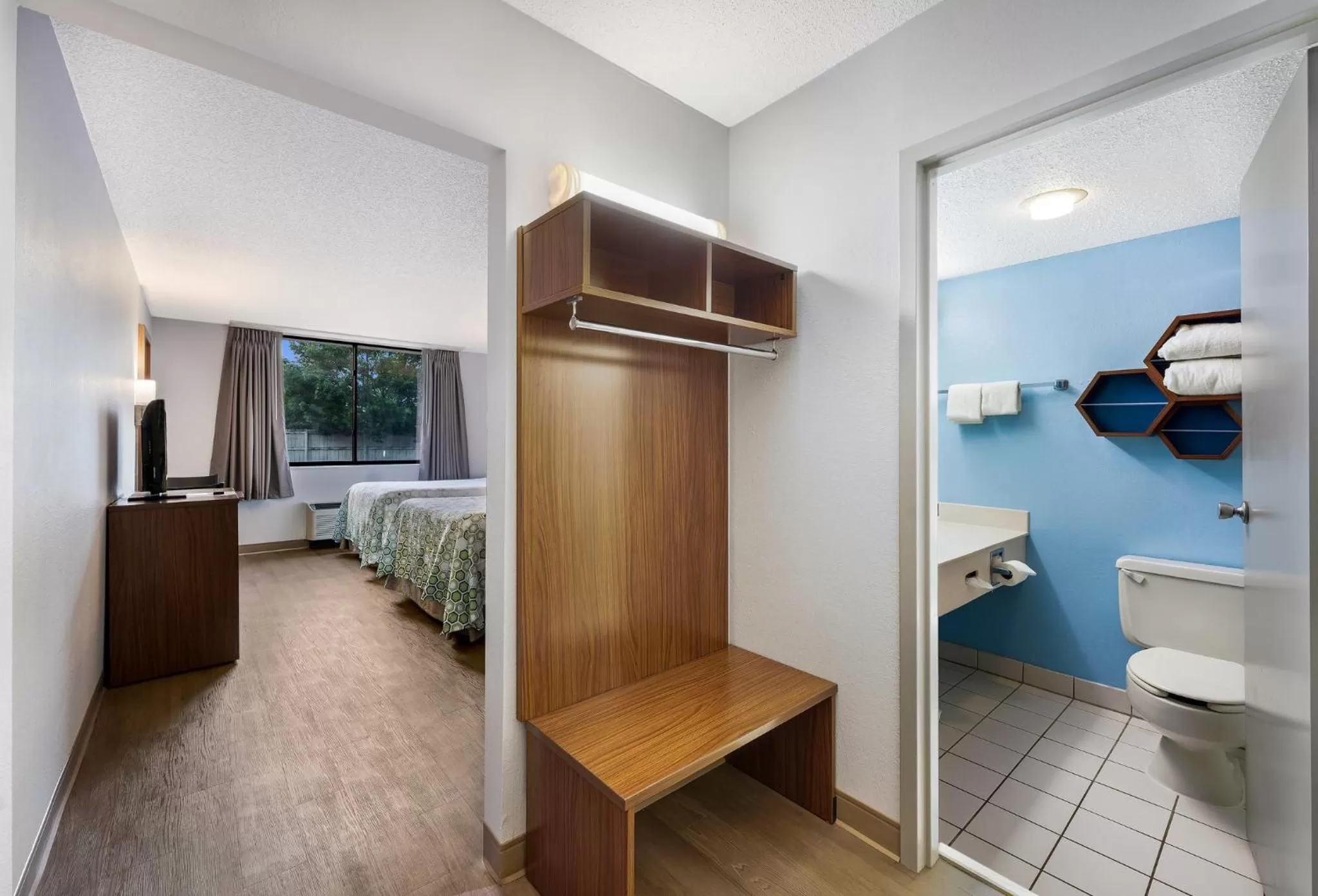 Photo of the whole room, Bed in HomeTowne Studios by Red Roof Painted Post