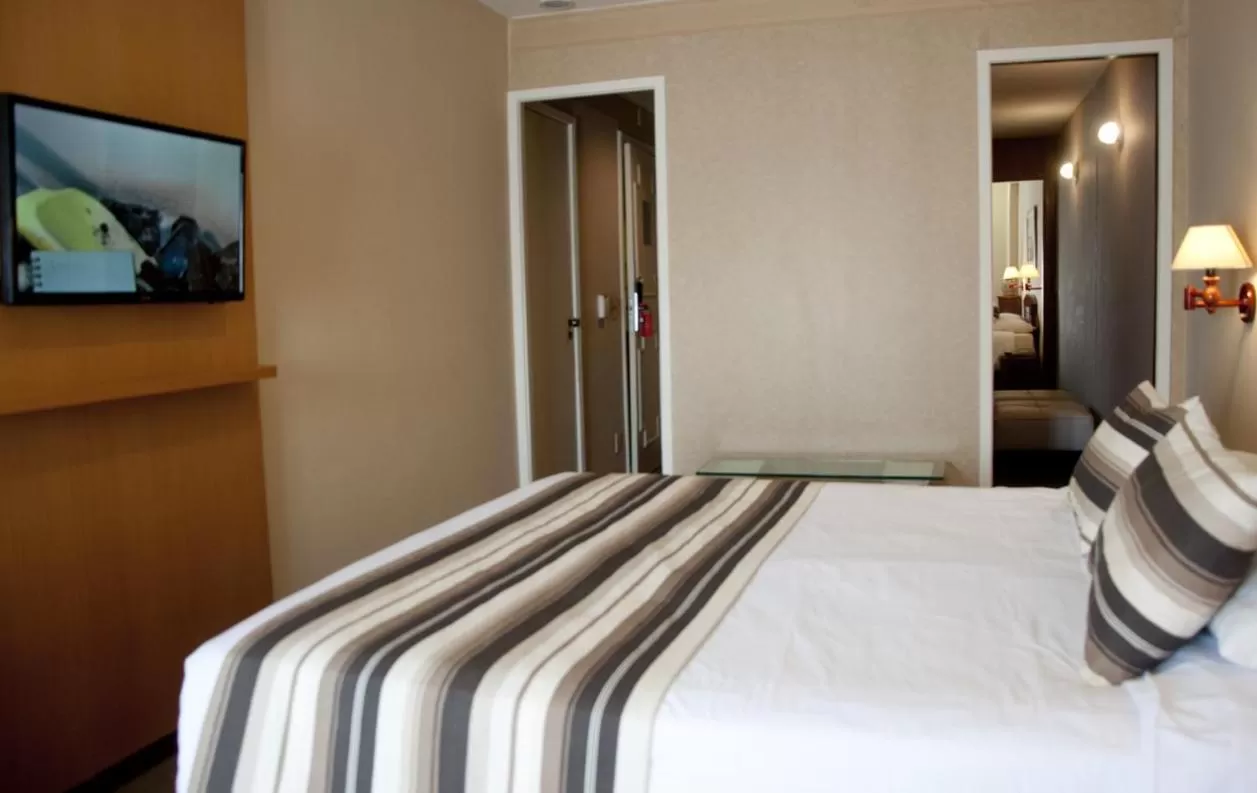 Bed in Augusto's Copacabana Hotel