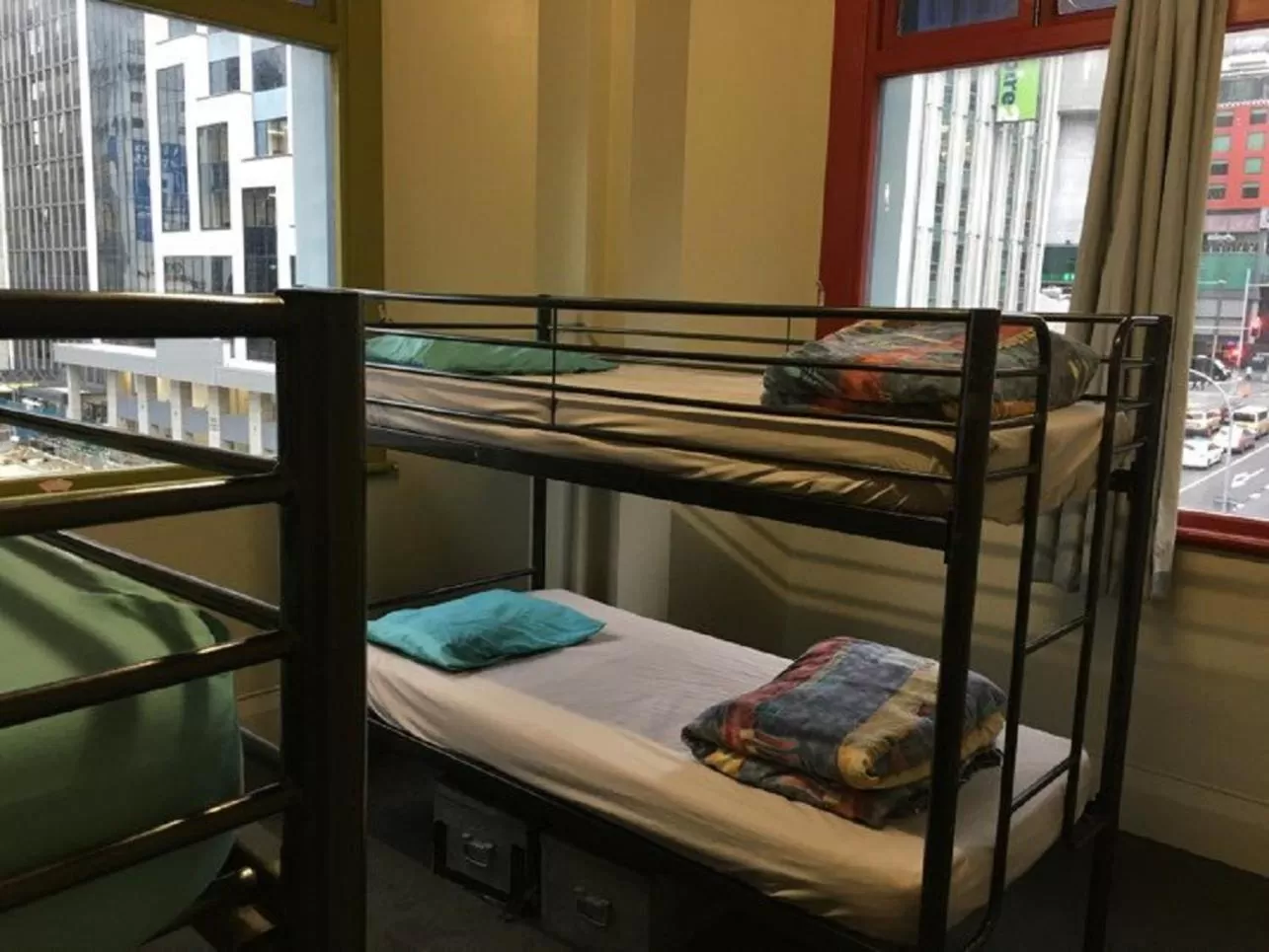 Bed in Surf 'N' Snow Backpackers Across Sky Tower