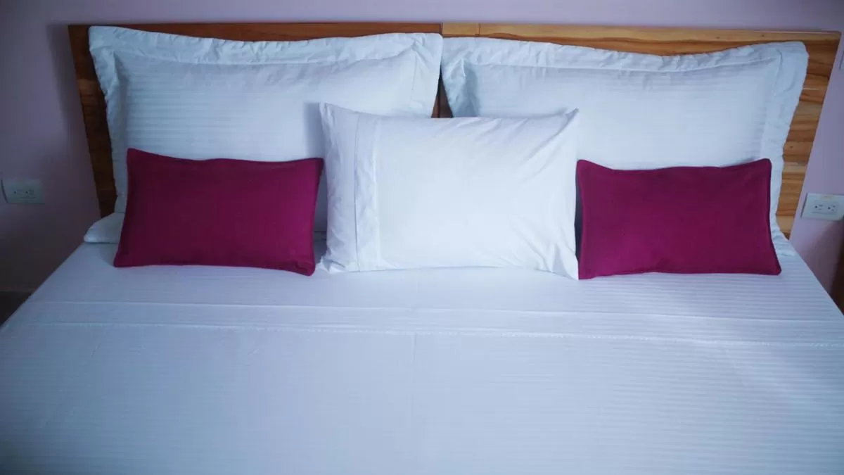 Bed in Kamaleb Farallones Hotel