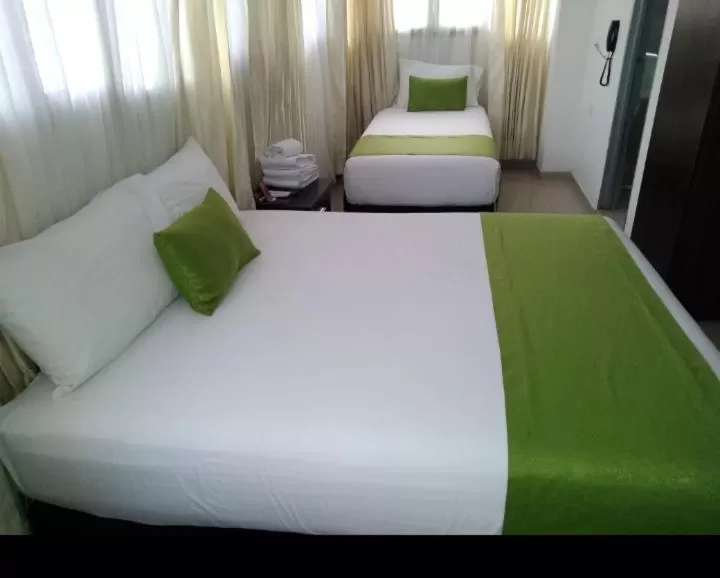 Bedroom, Bed in Hotel Cafe Plaza