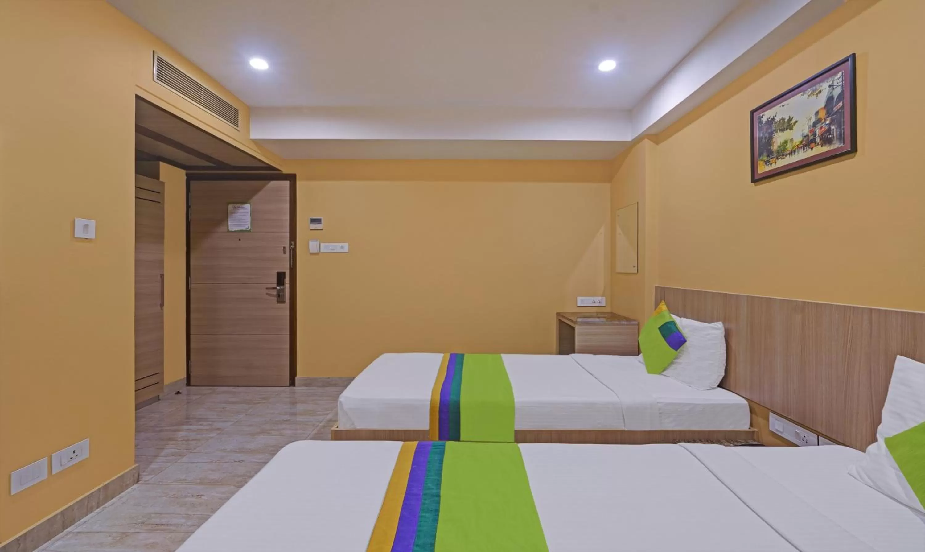 Bedroom, Bed in Treebo Fourth Avenue