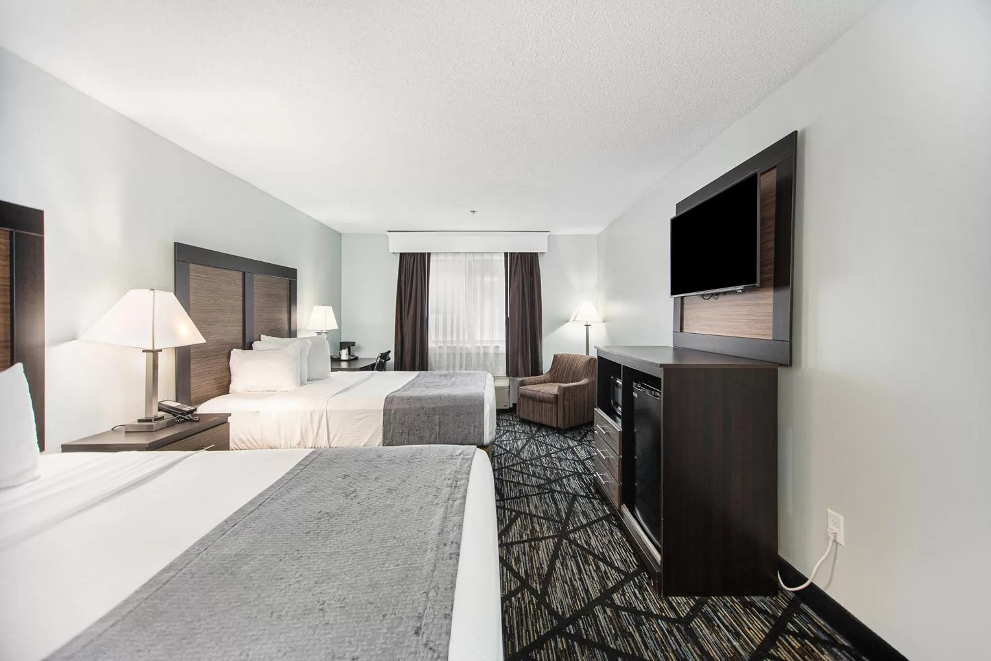 Bed in Baymont by Wyndham Grand Haven