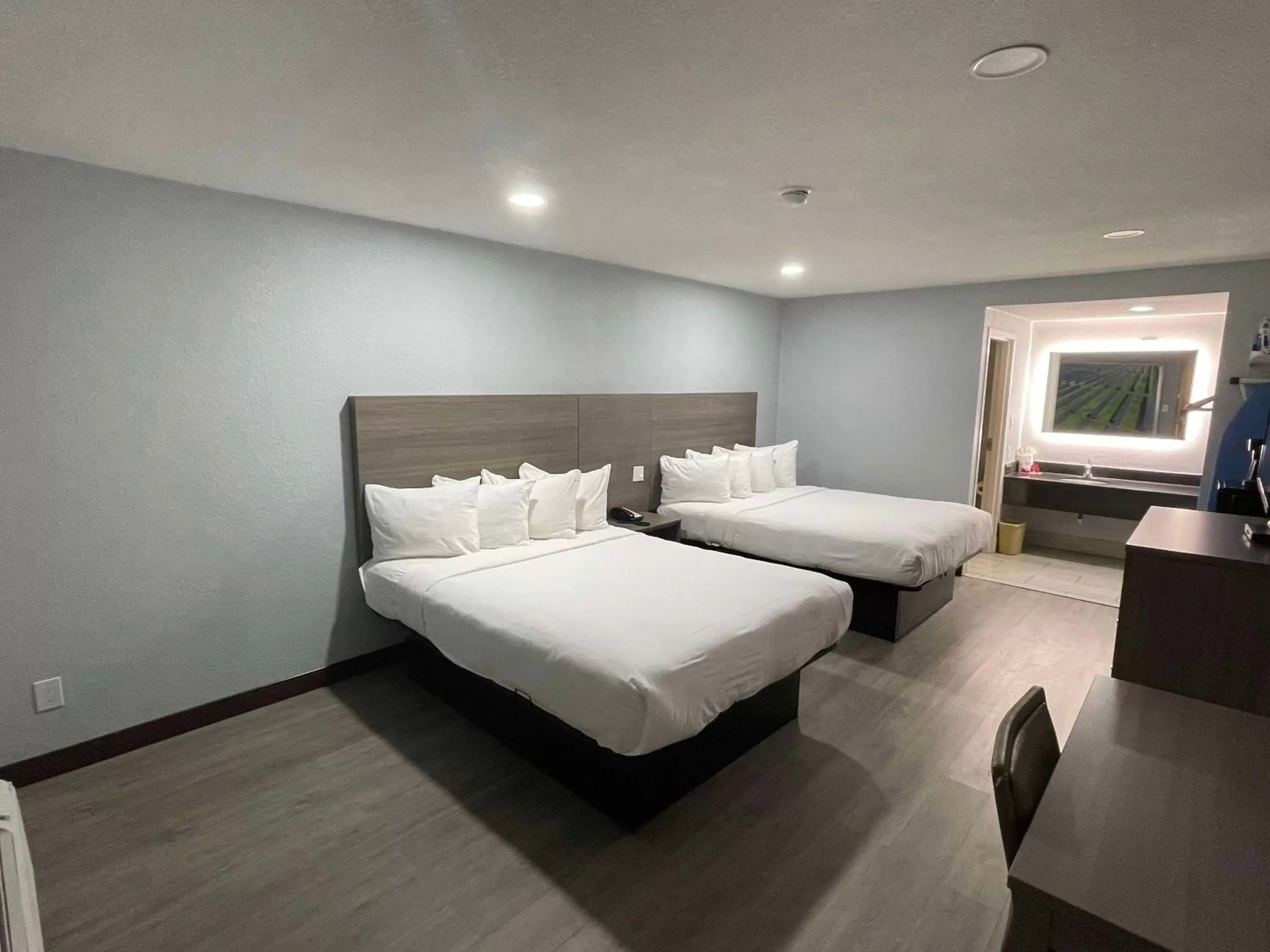 Queen Room with Two Queen Beds and Bath Tub - Disability Access in SureStay Hotel by Best Western Childress Queen Room with Two Queen Beds and Bath Tub - Disability Access in SureStay Hotel by Best Western Childress