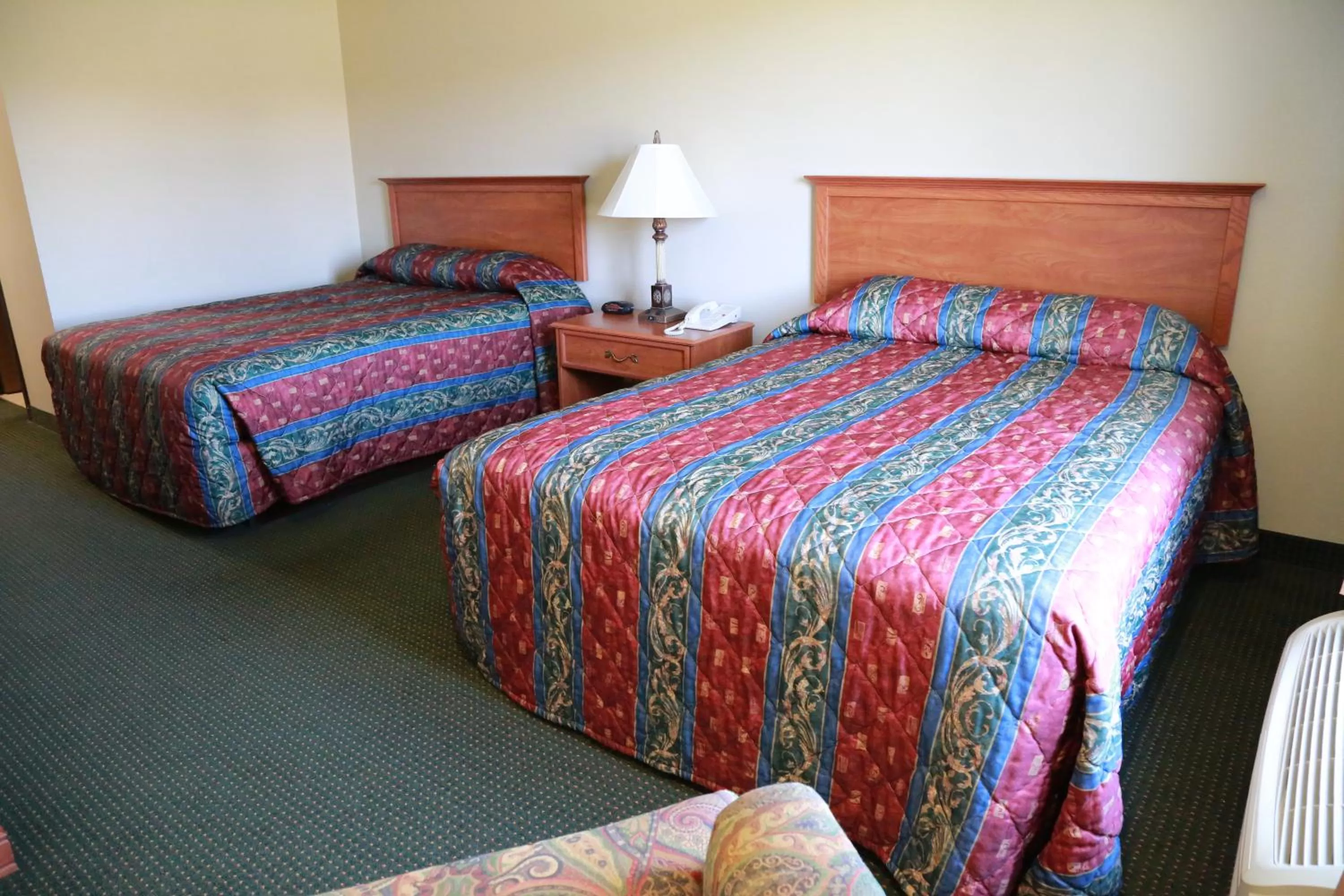 Bed in Horizon Inn & Suites