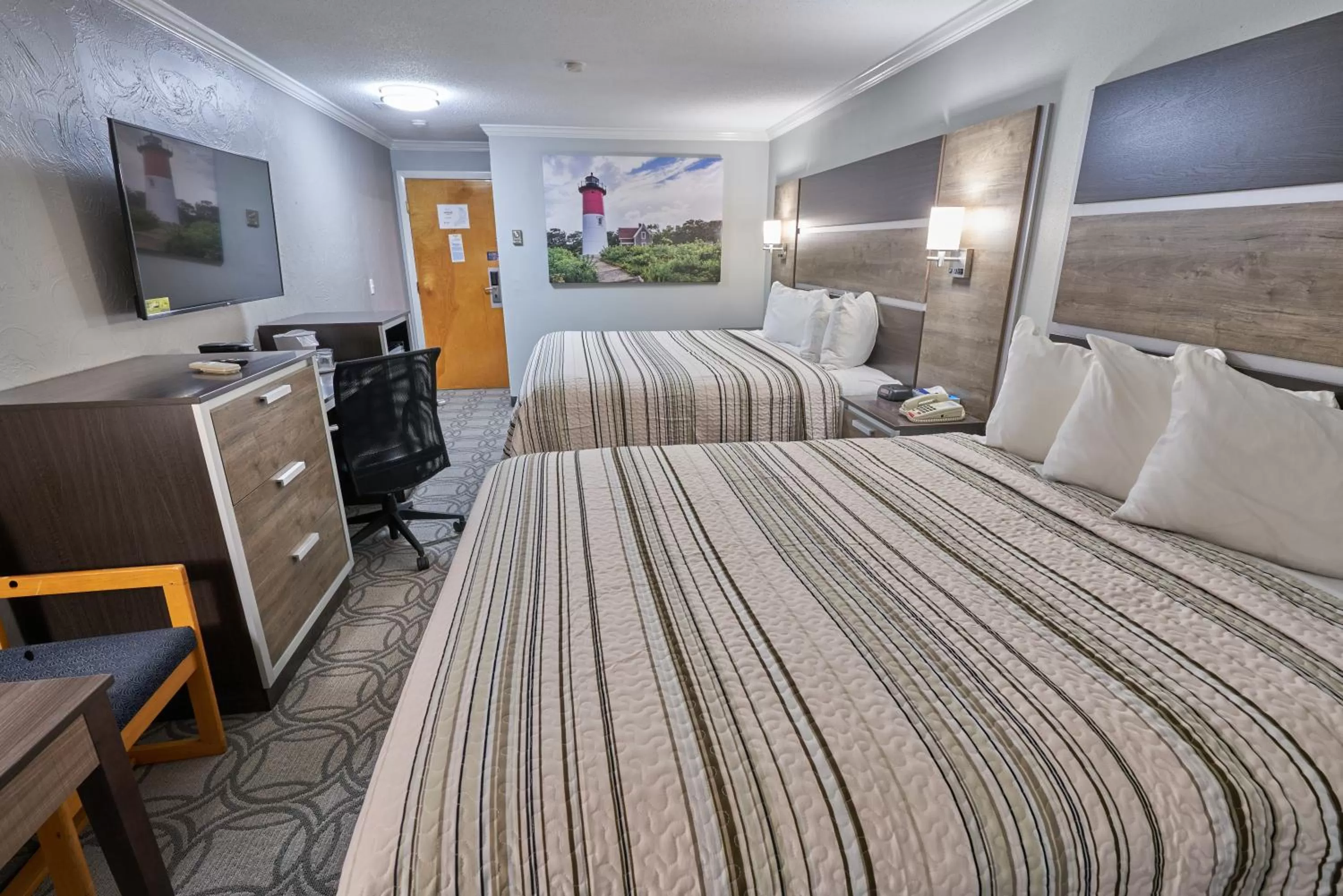 Bed in Ambassador Inn and Suites