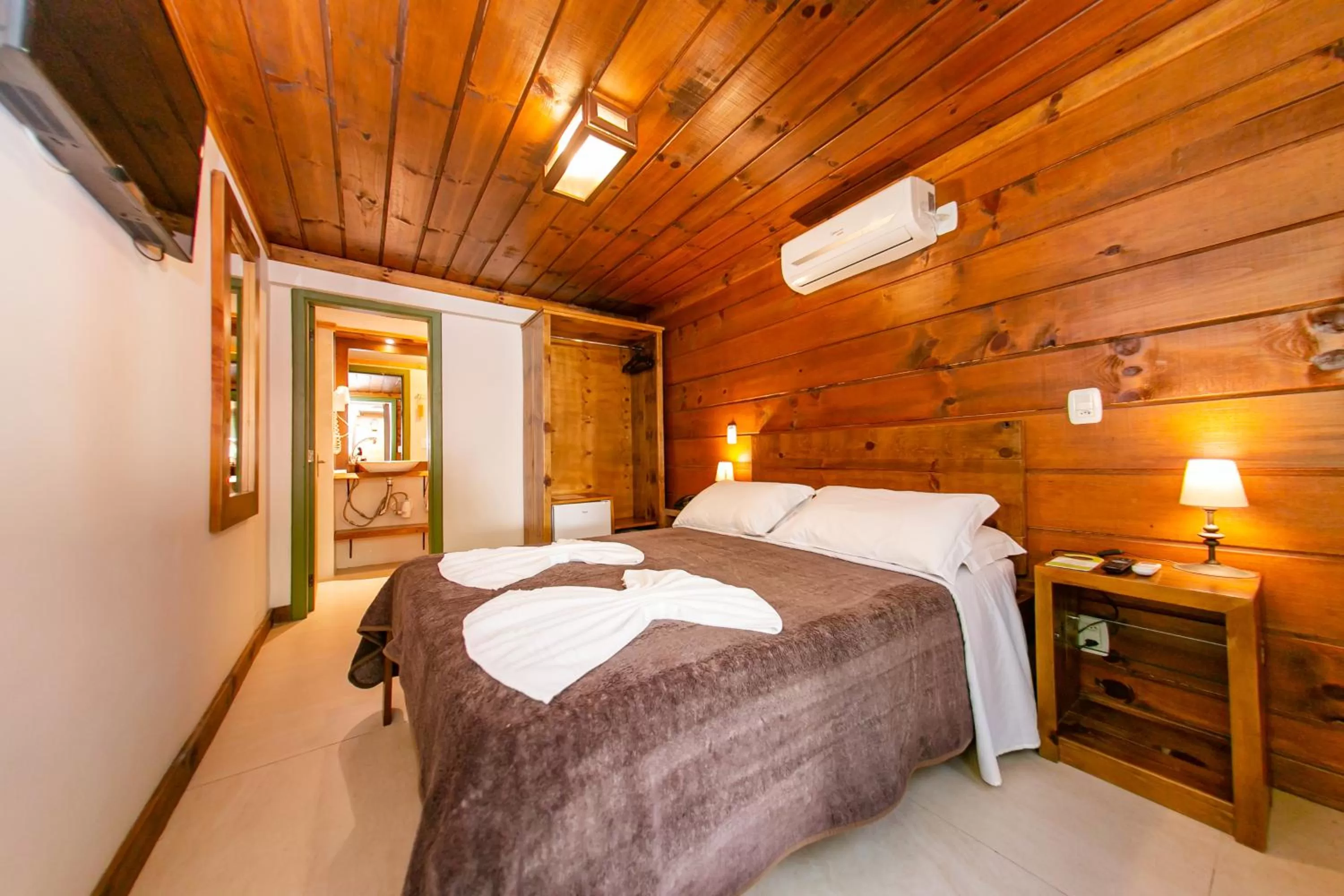 Bed in Pousada Charm Canela