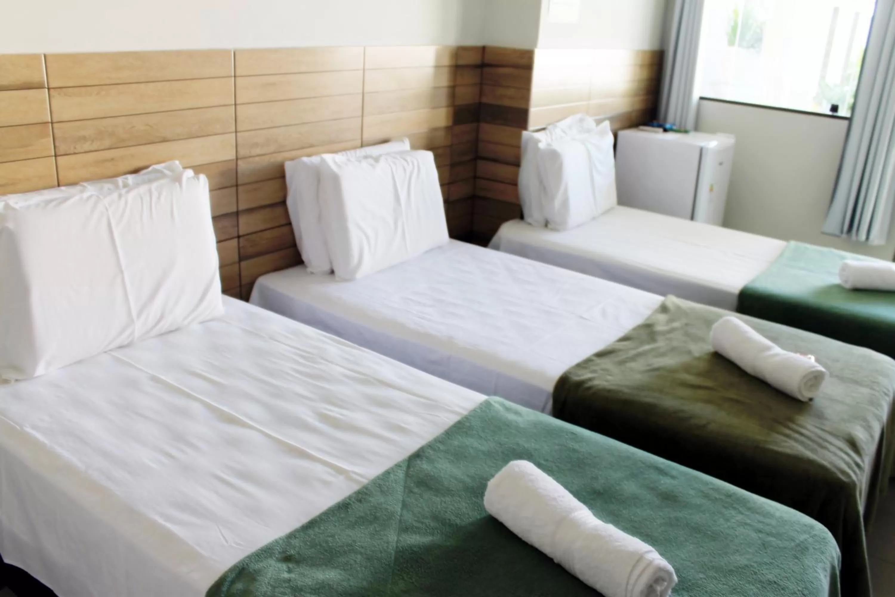 Bed in Pousada Das Palmeiras