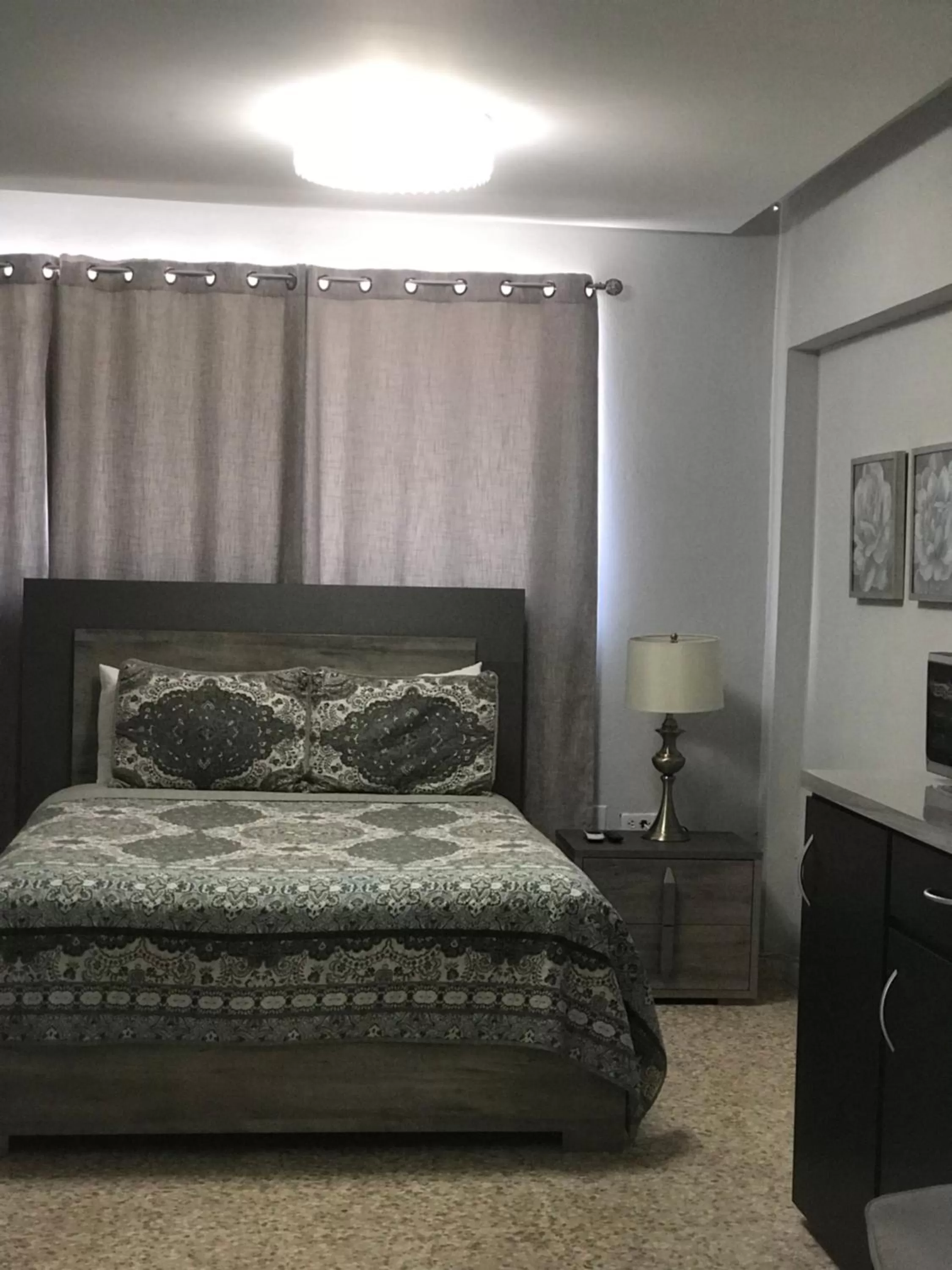 Bed in Itza-Bella Suites