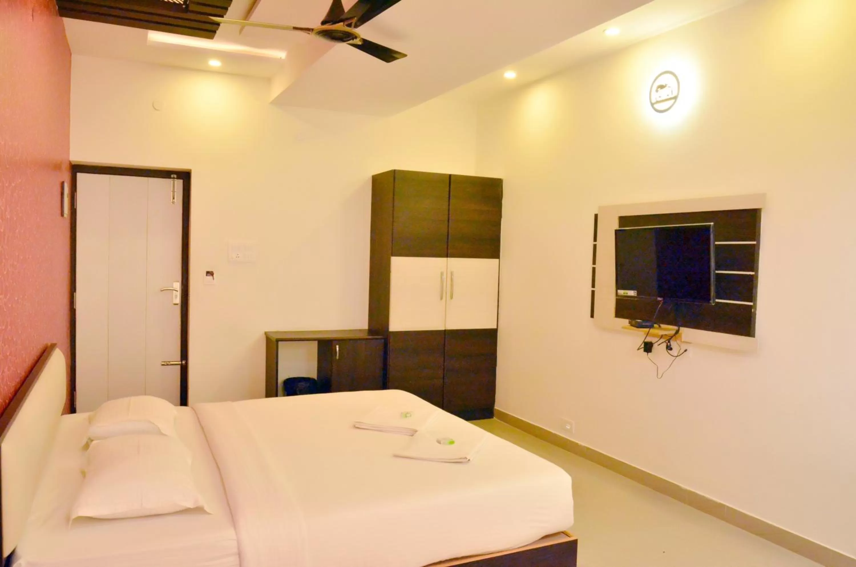 Bed in Hotel Ambai Grand