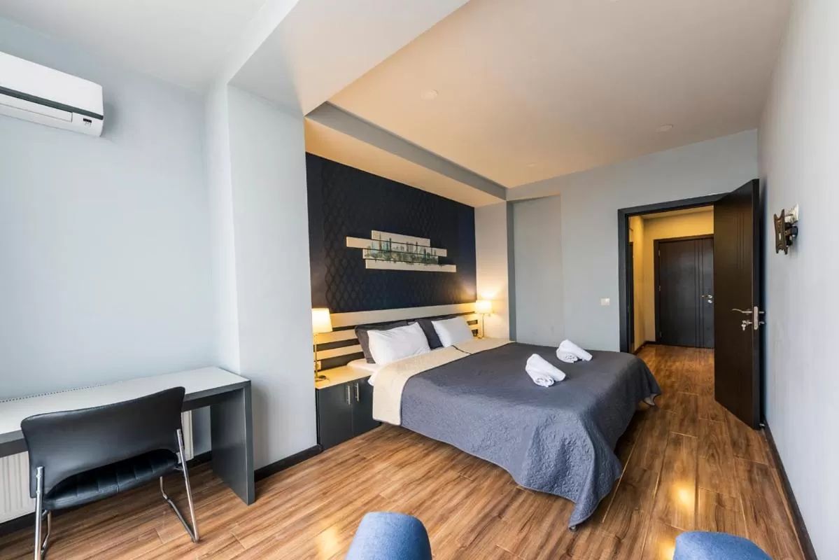 Bed in Sani Apart Hotel