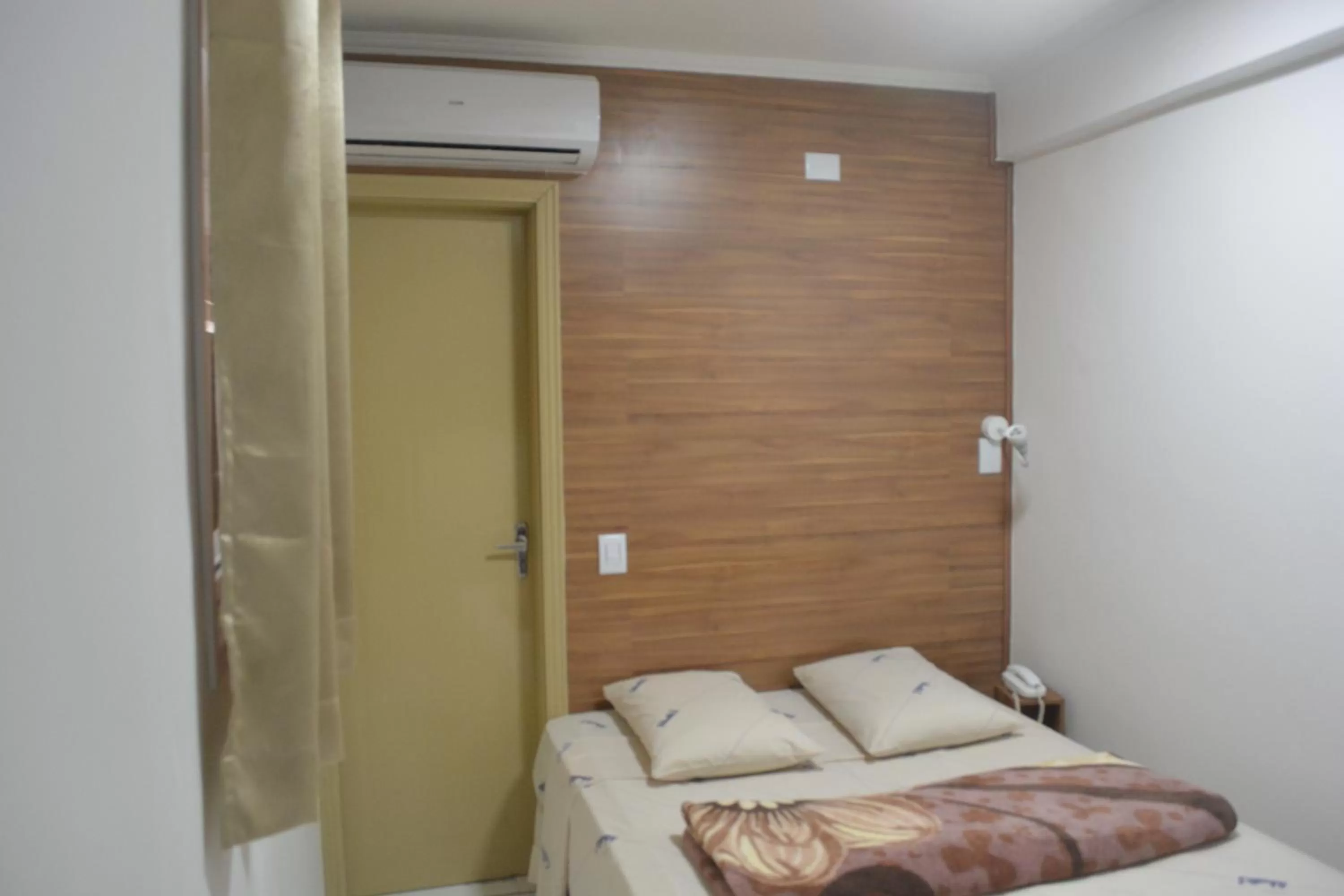 Bed in New Point Hotel