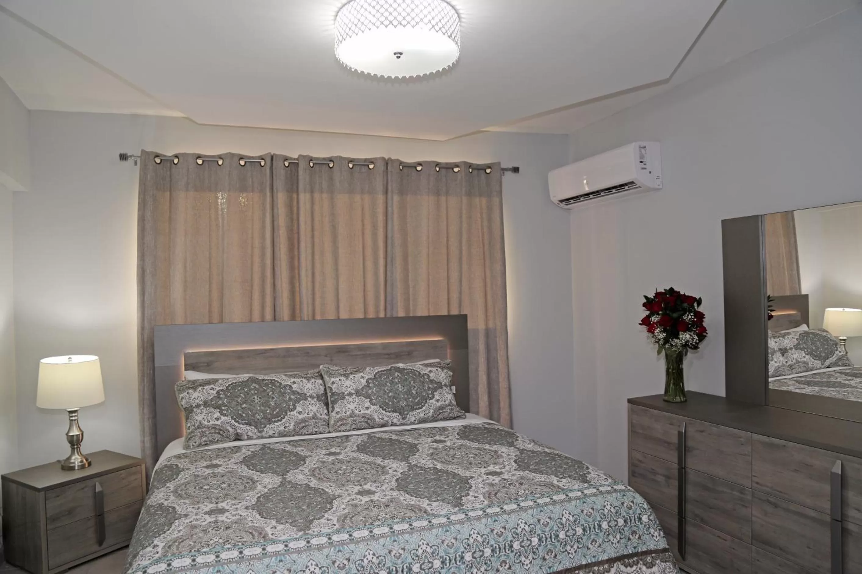 Bed in Itza-Bella Suites